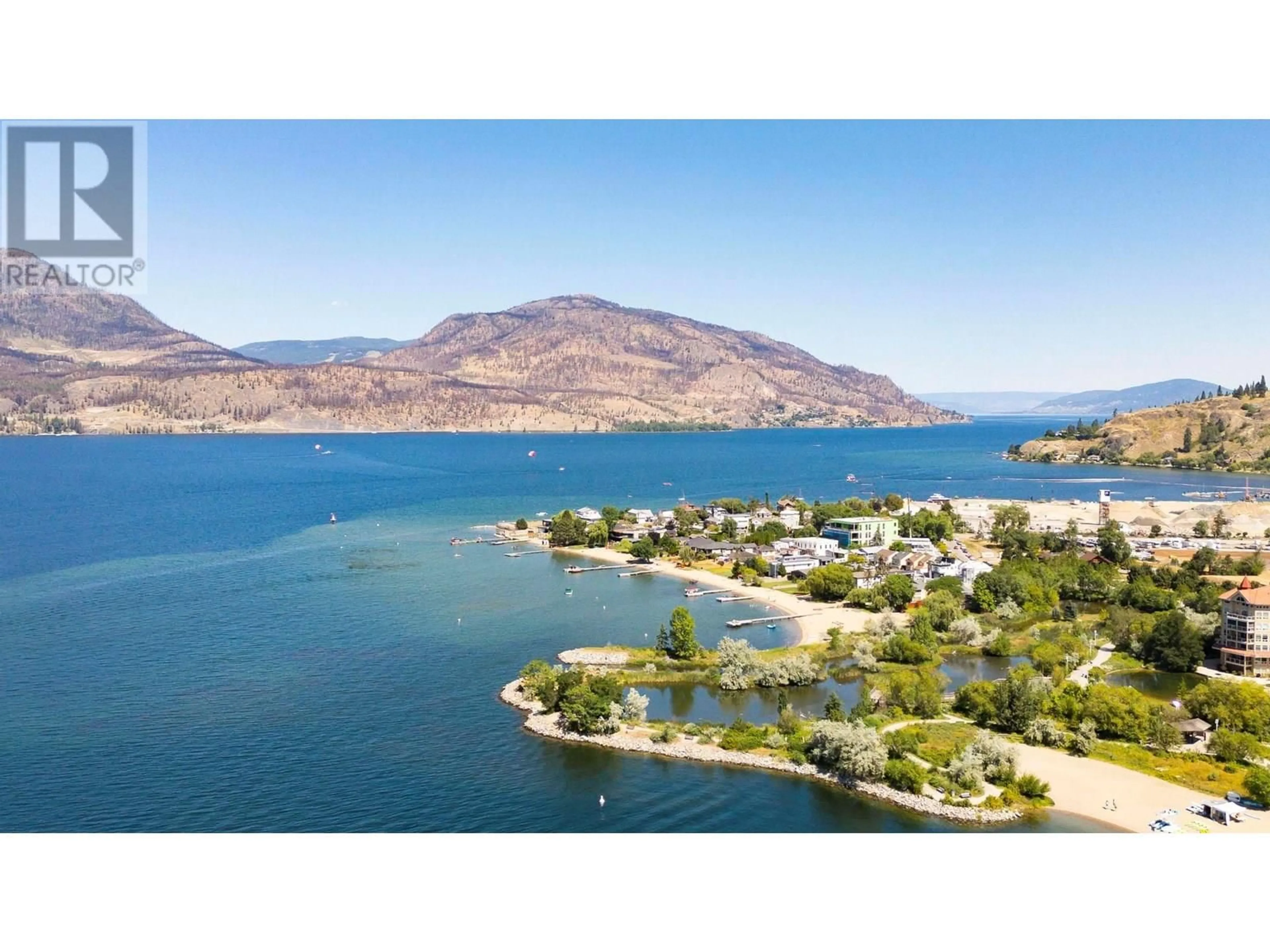 A pic from outside/outdoor area/front of a property/back of a property/a pic from drone, water/lake/river/ocean view for 501 - 1181 SUNSET DRIVE, Kelowna British Columbia V1Y0J4