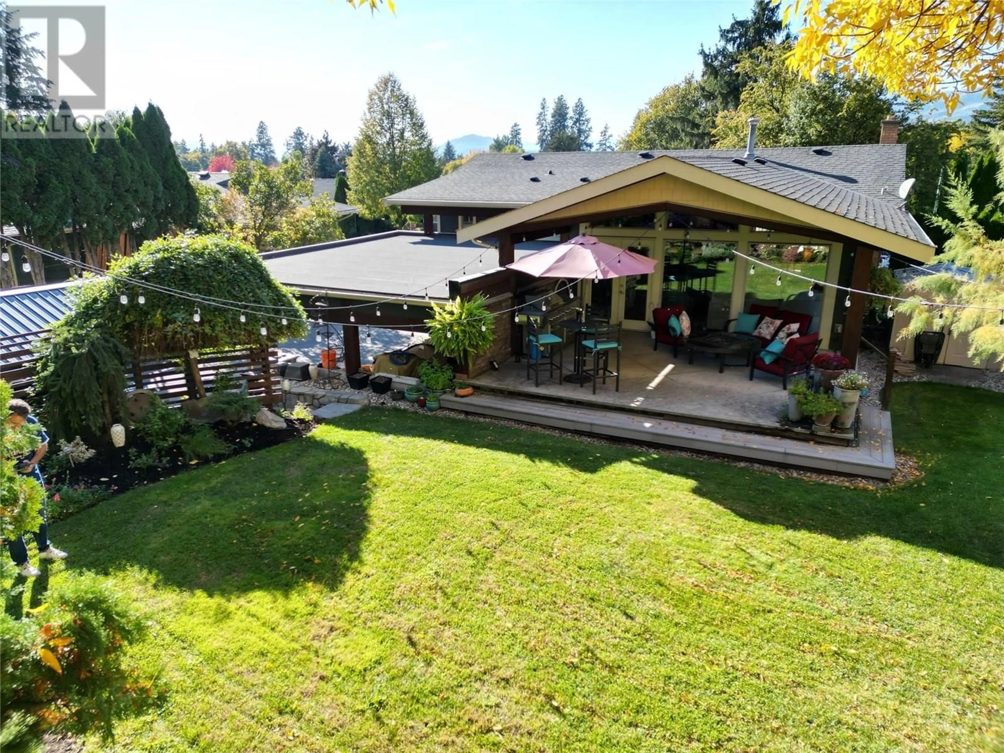 A pic from outside/outdoor area/front of a property/back of a property/a pic from drone, mountain view for 1115 PINECREST LANE, Kelowna British Columbia V1Y4L4