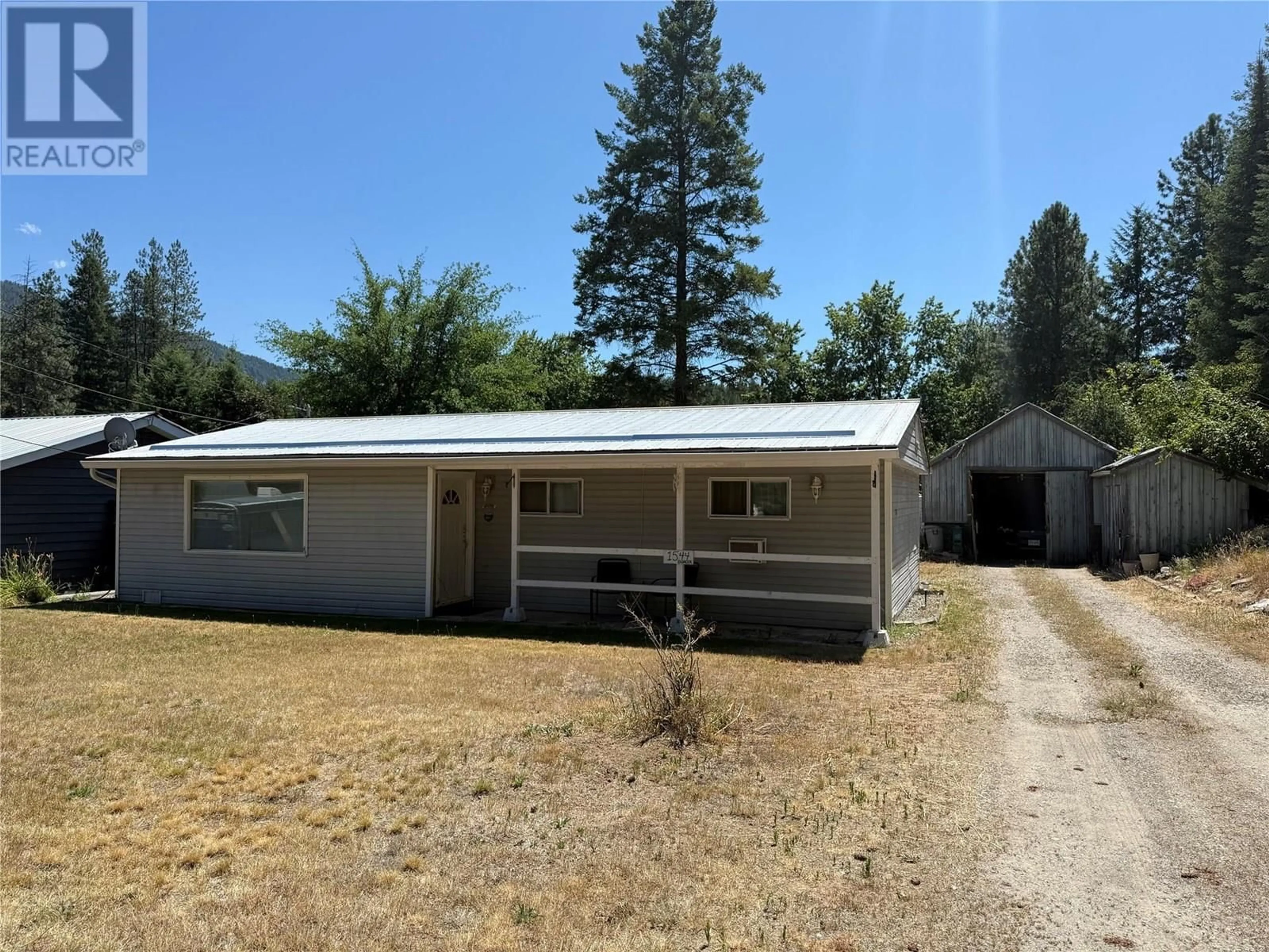 Home with vinyl exterior material, street for 1544 BURGER ROAD, Christina Lake British Columbia V0H1E0