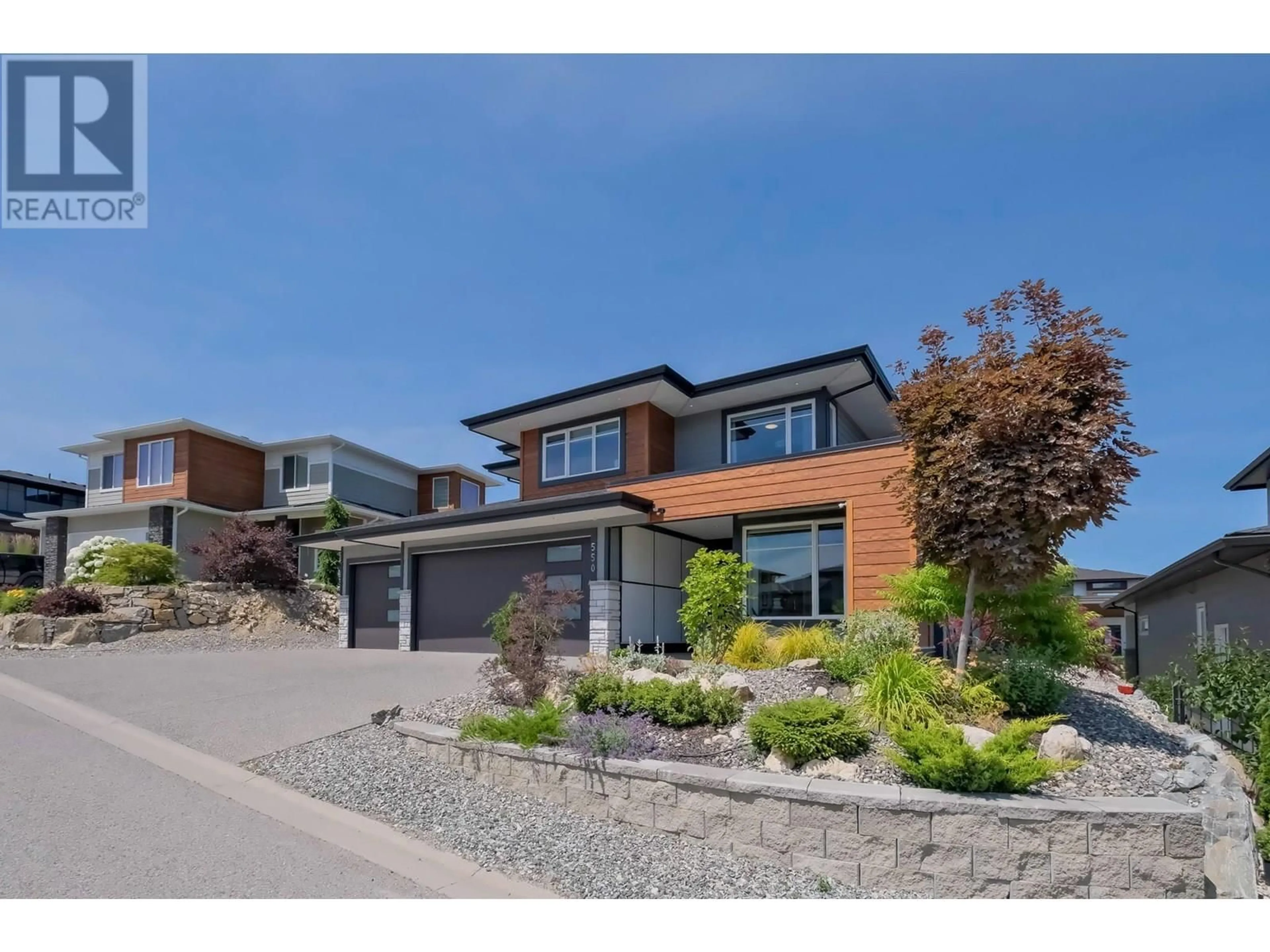 Home with brick exterior material, street for 550 BARRA LANE, Kelowna British Columbia V1P1T3