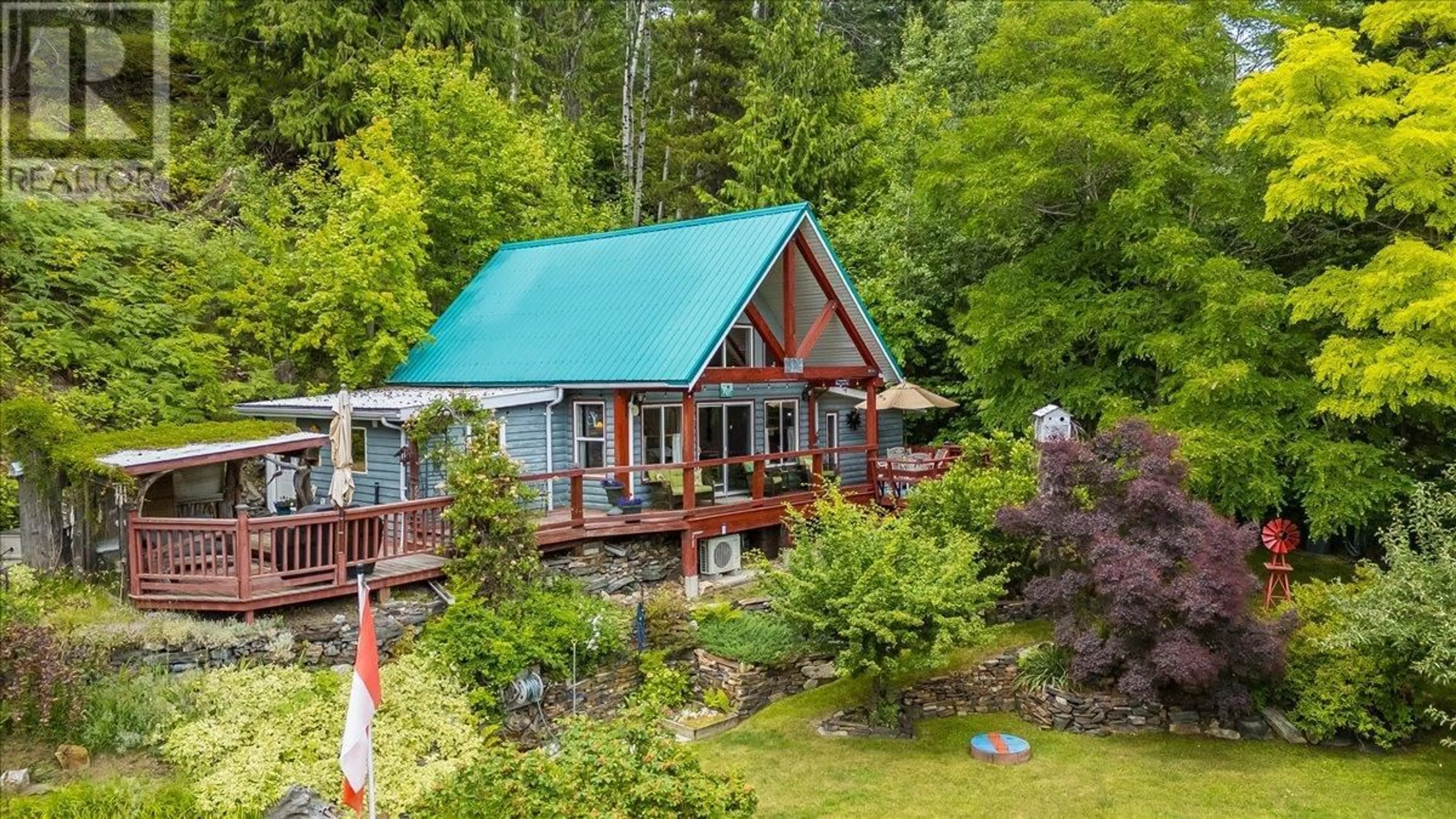 A pic from outside/outdoor area/front of a property/back of a property/a pic from drone, water/lake/river/ocean view for 5529 HIGHWAY 31 OTHER, Mirror Lake British Columbia V0G1M0