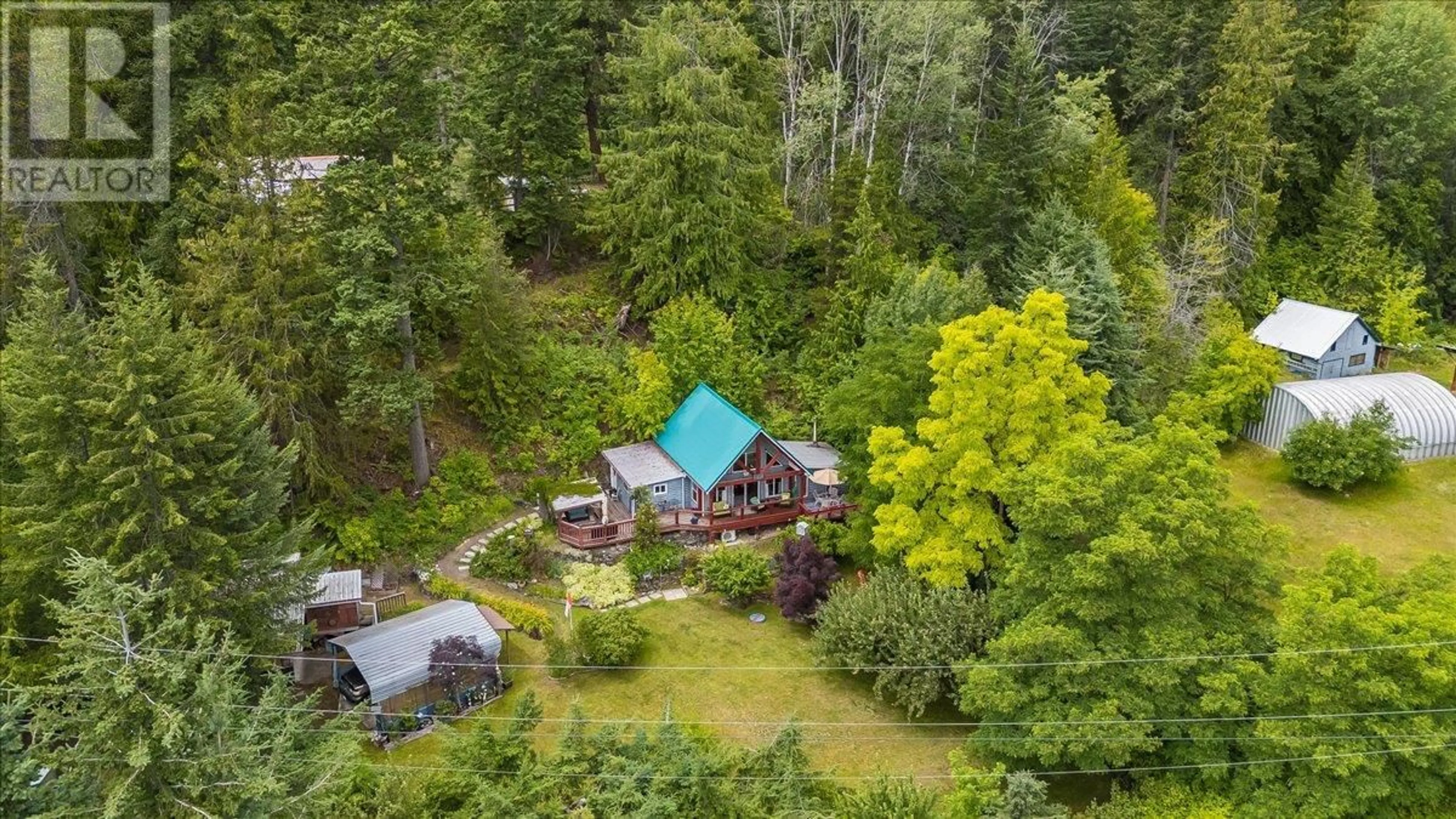 A pic from outside/outdoor area/front of a property/back of a property/a pic from drone, forest/trees view for 5529 HIGHWAY 31 OTHER, Mirror Lake British Columbia V0G1M0