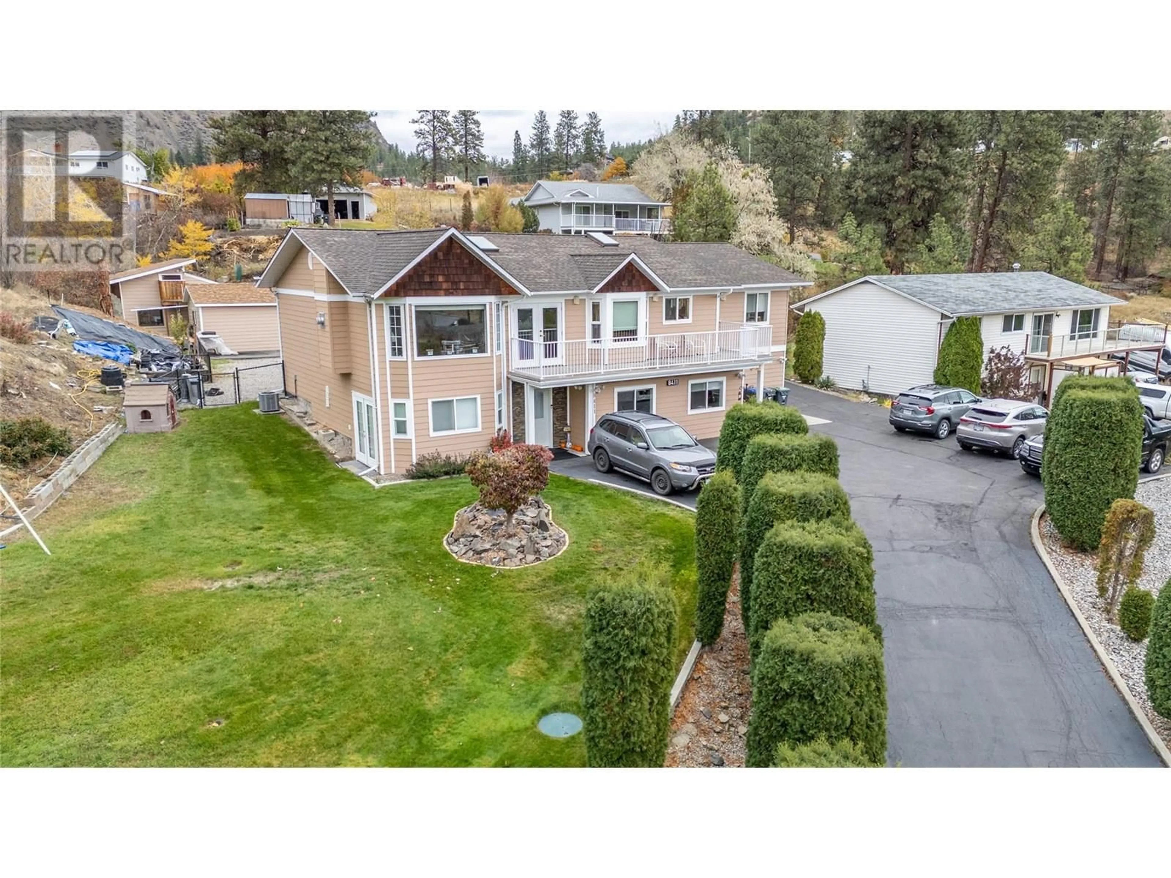 A pic from outside/outdoor area/front of a property/back of a property/a pic from drone, unknown for 8411 VICTORIA ROAD SOUTH, Summerland British Columbia V0H1Z2