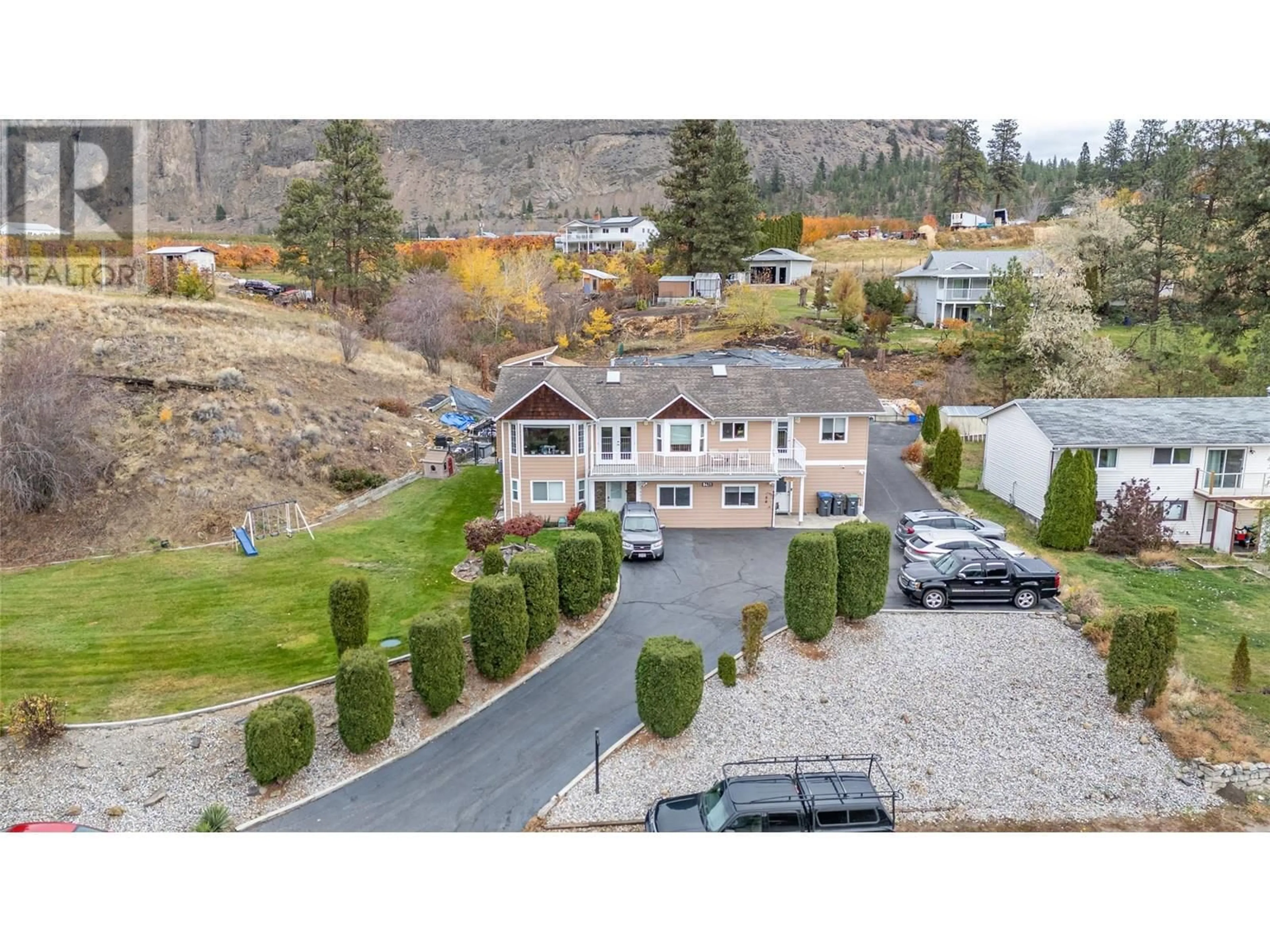 A pic from outside/outdoor area/front of a property/back of a property/a pic from drone, mountain view for 8411 VICTORIA ROAD SOUTH, Summerland British Columbia V0H1Z2