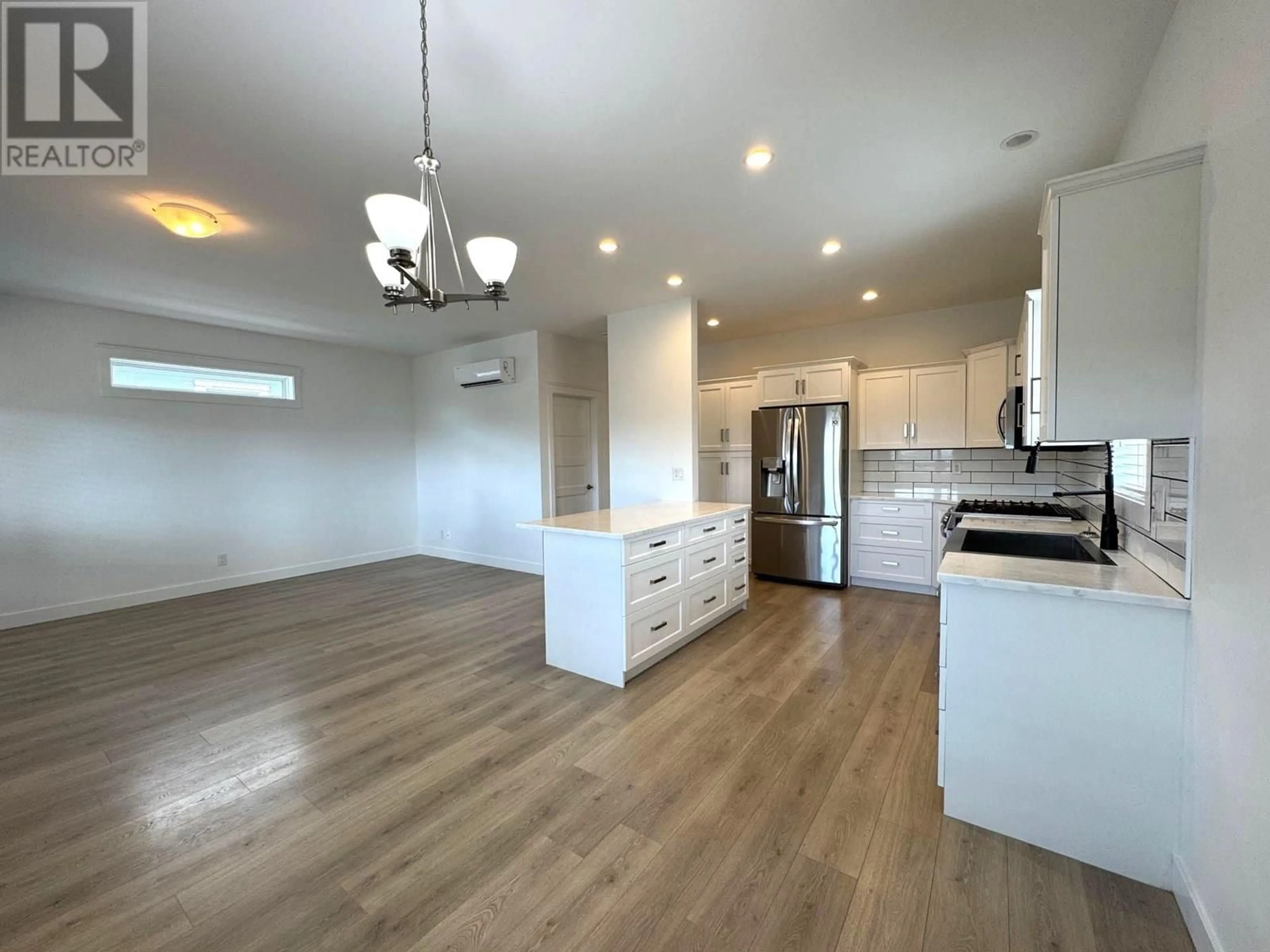 Open concept kitchen, wood/laminate floor for 501 - 2440 OLD OKANAGAN HIGHWAY, Westbank British Columbia V4T3A3