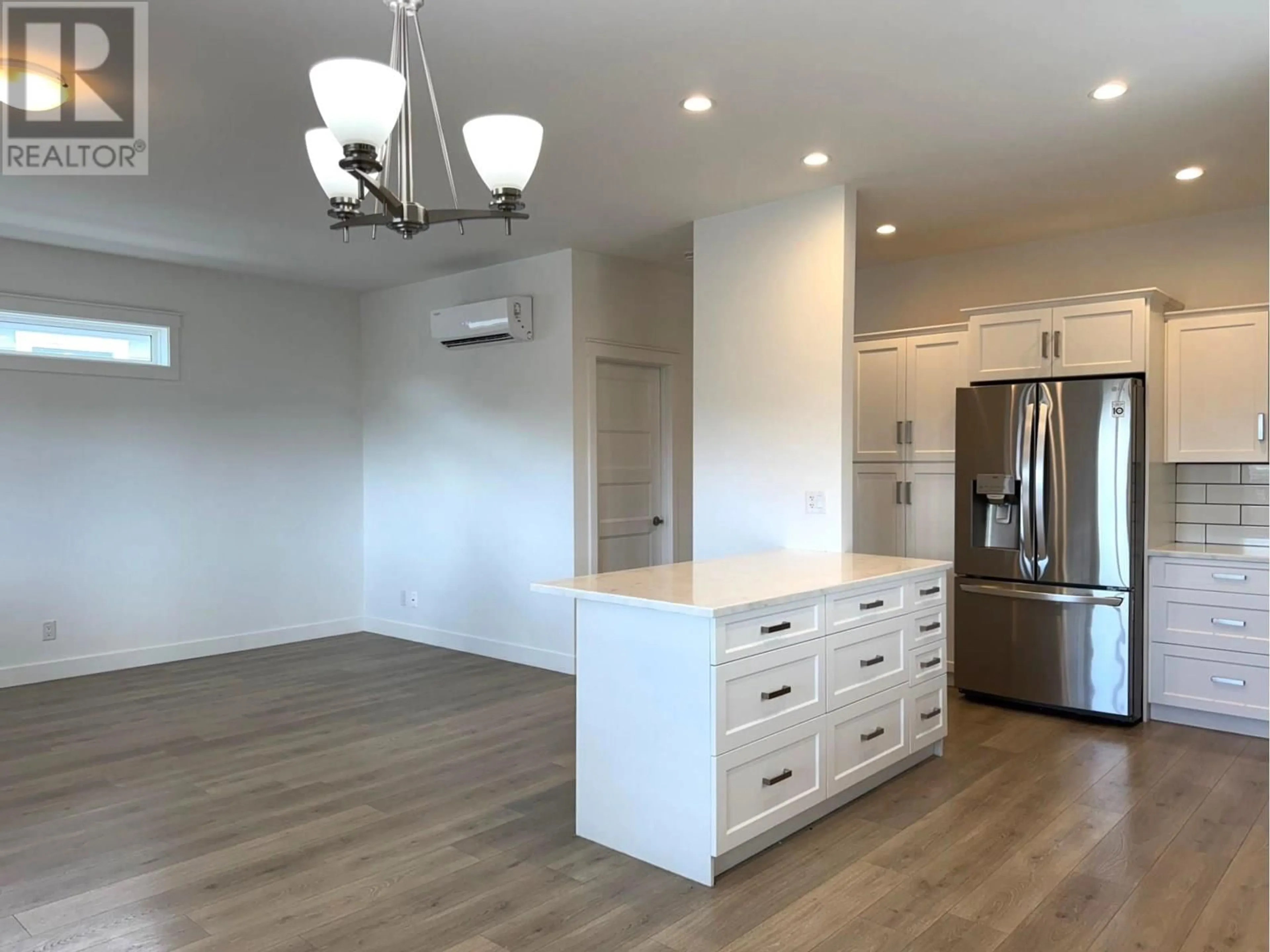 Open concept kitchen, wood/laminate floor for 501 - 2440 OLD OKANAGAN HIGHWAY, Westbank British Columbia V4T3A3