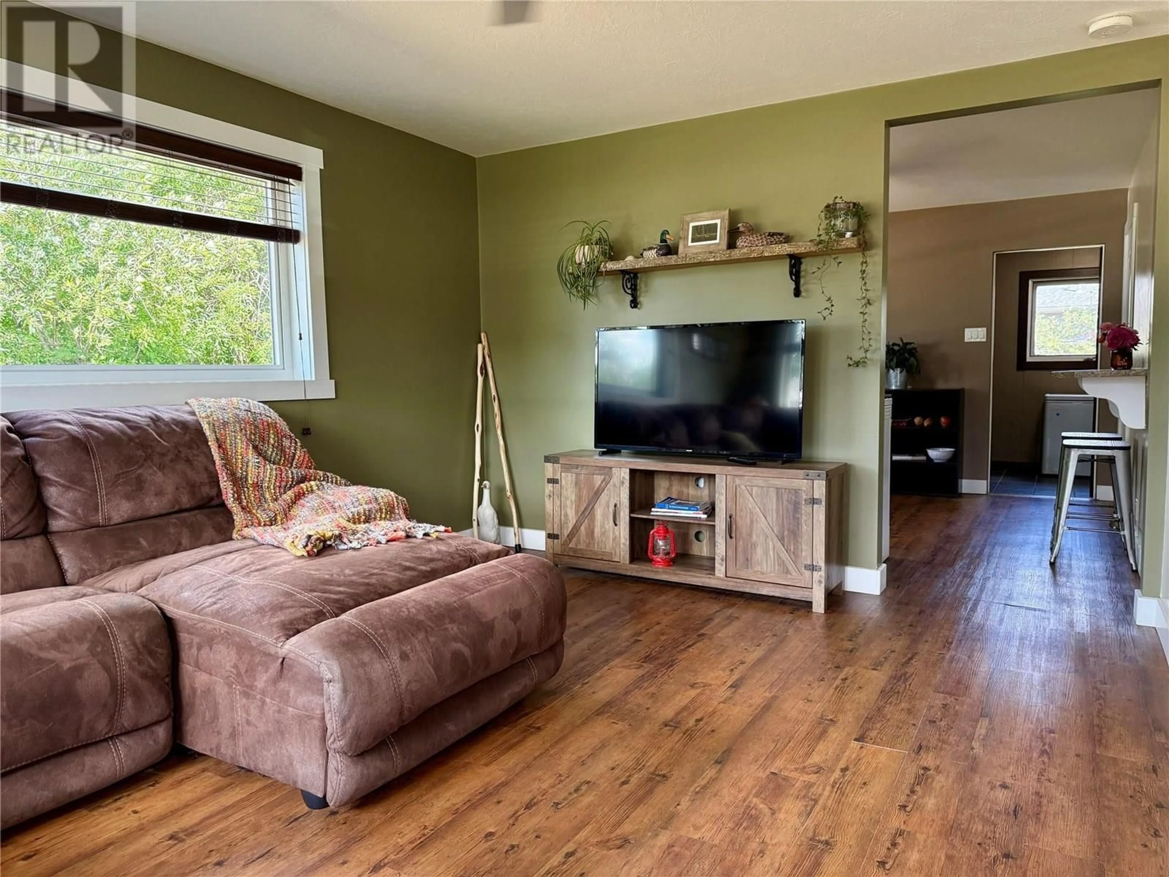 Living room with furniture, wood/laminate floor for 5207 51 AVENUE, Pouce Coupe British Columbia V0C2C0