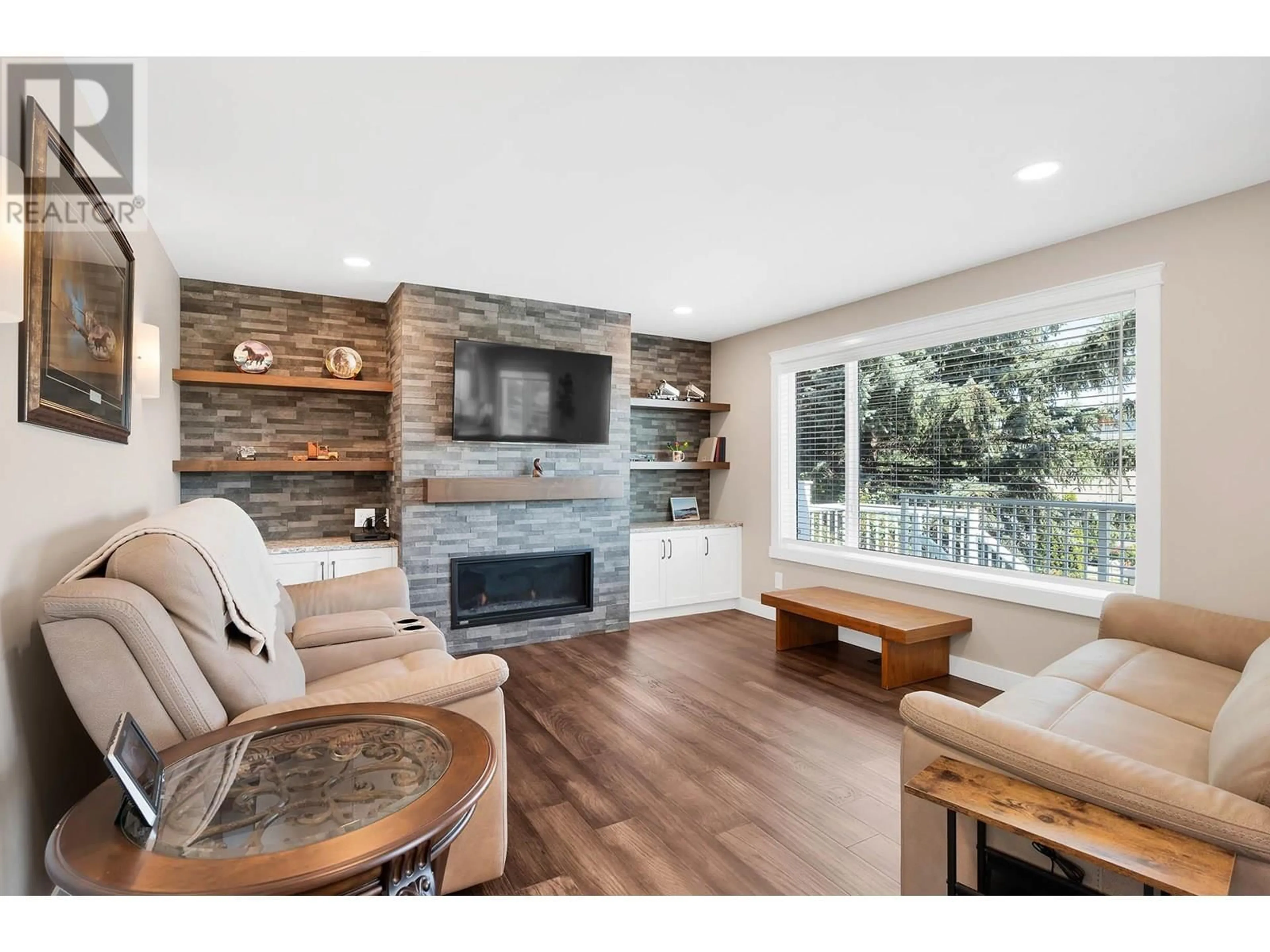 Living room with furniture, wood/laminate floor for 6102 MEADOWLAND CRESCENT SOUTH, Kamloops British Columbia V2C6X3