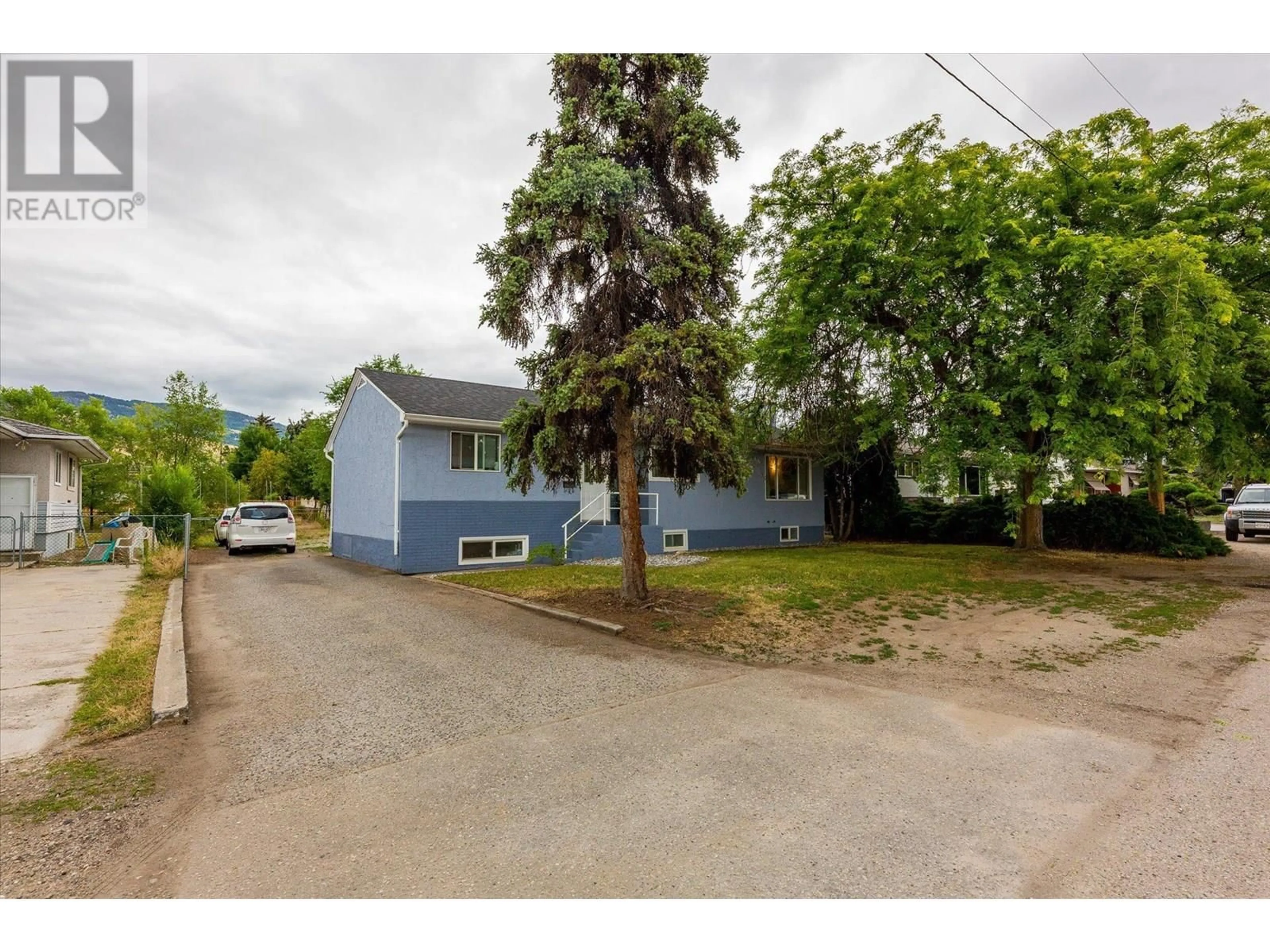 A pic from outside/outdoor area/front of a property/back of a property/a pic from drone, street for 525 DONHAUSER ROAD, Kelowna British Columbia V1X3G1