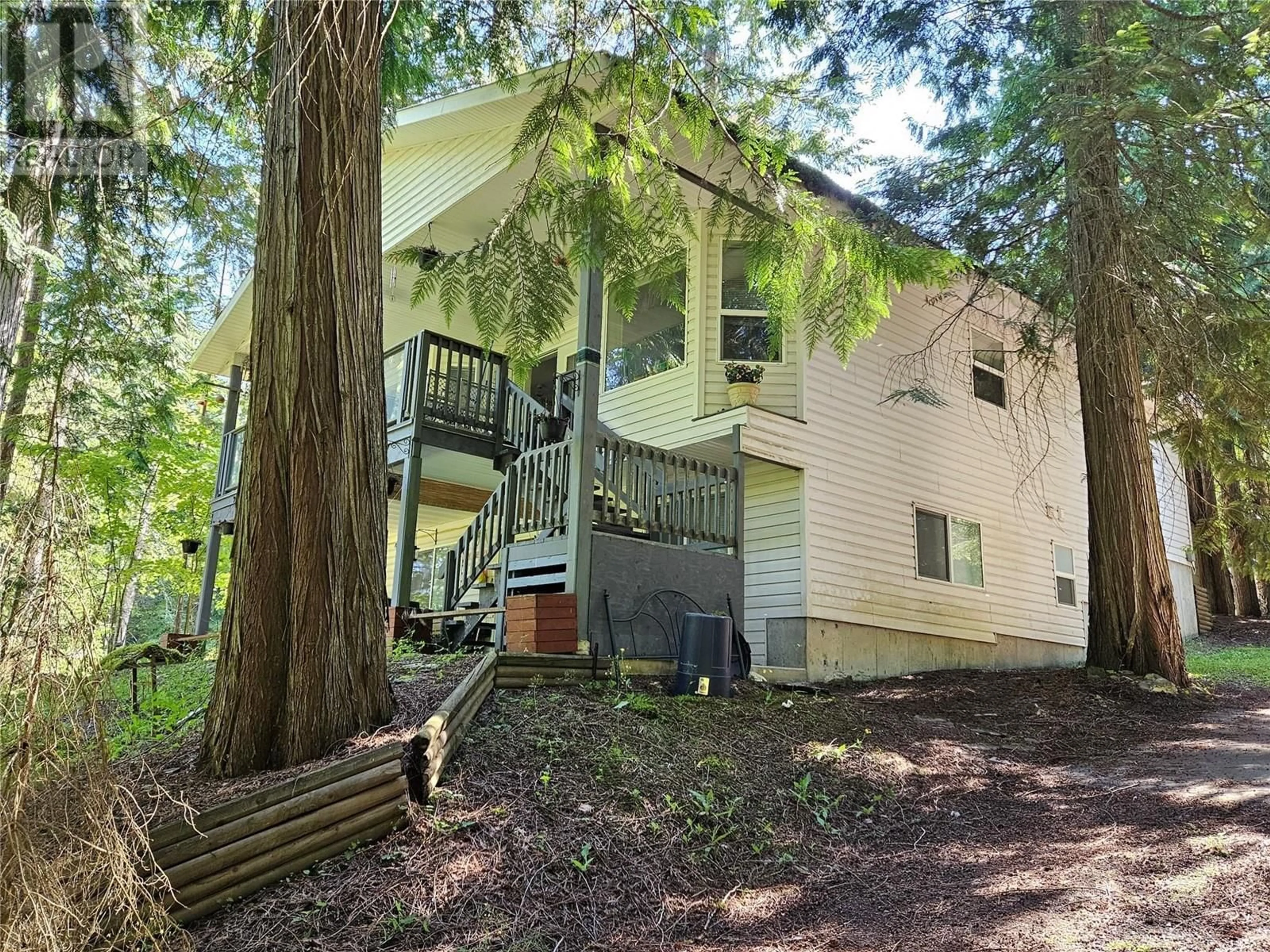 A pic from outside/outdoor area/front of a property/back of a property/a pic from drone, forest/trees view for 534 BAYVIEW ROAD, Nakusp British Columbia V0G1R1