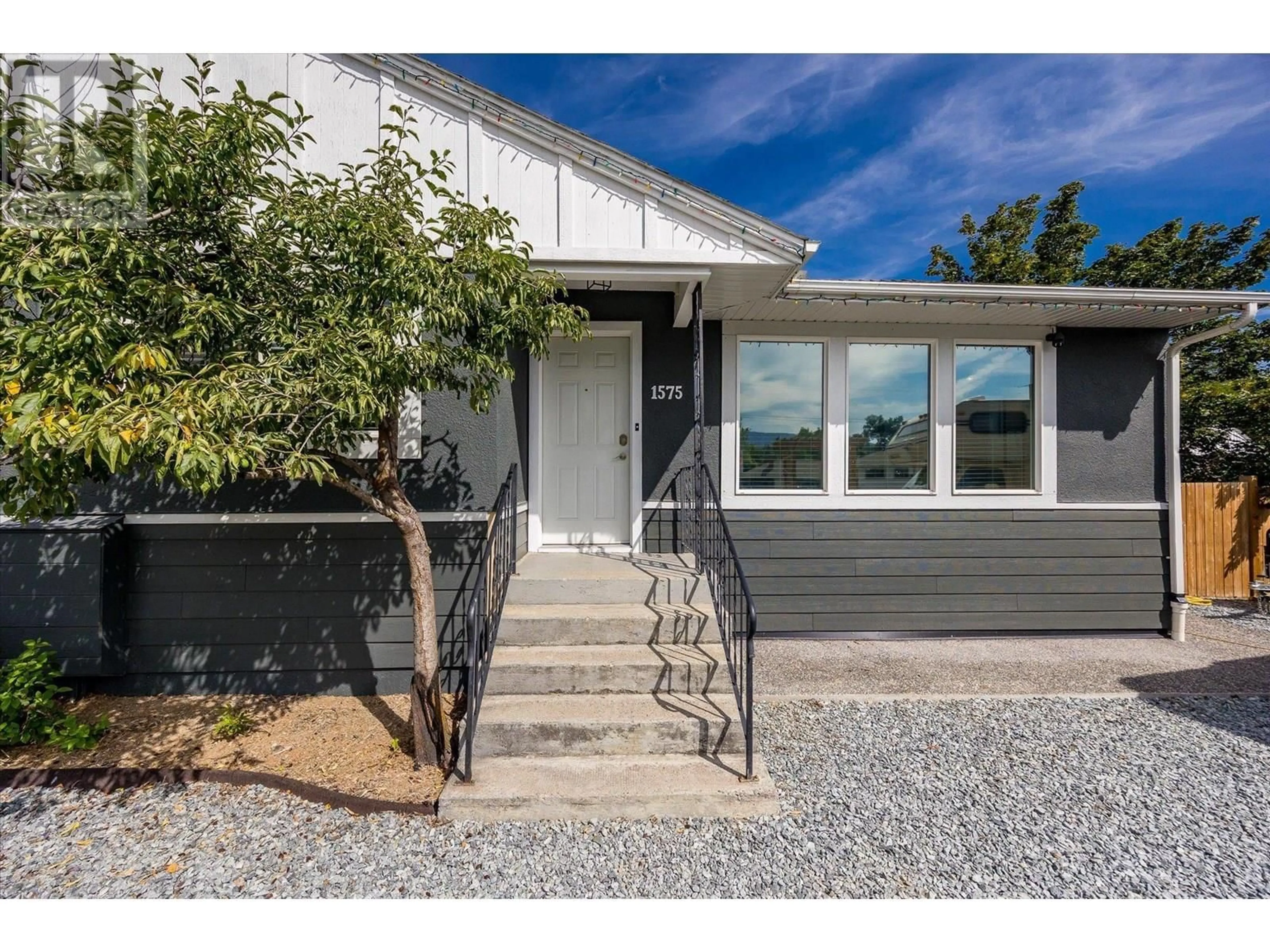 Home with vinyl exterior material, street for 1575 HIGH ROAD, Kelowna British Columbia V1Y7B7