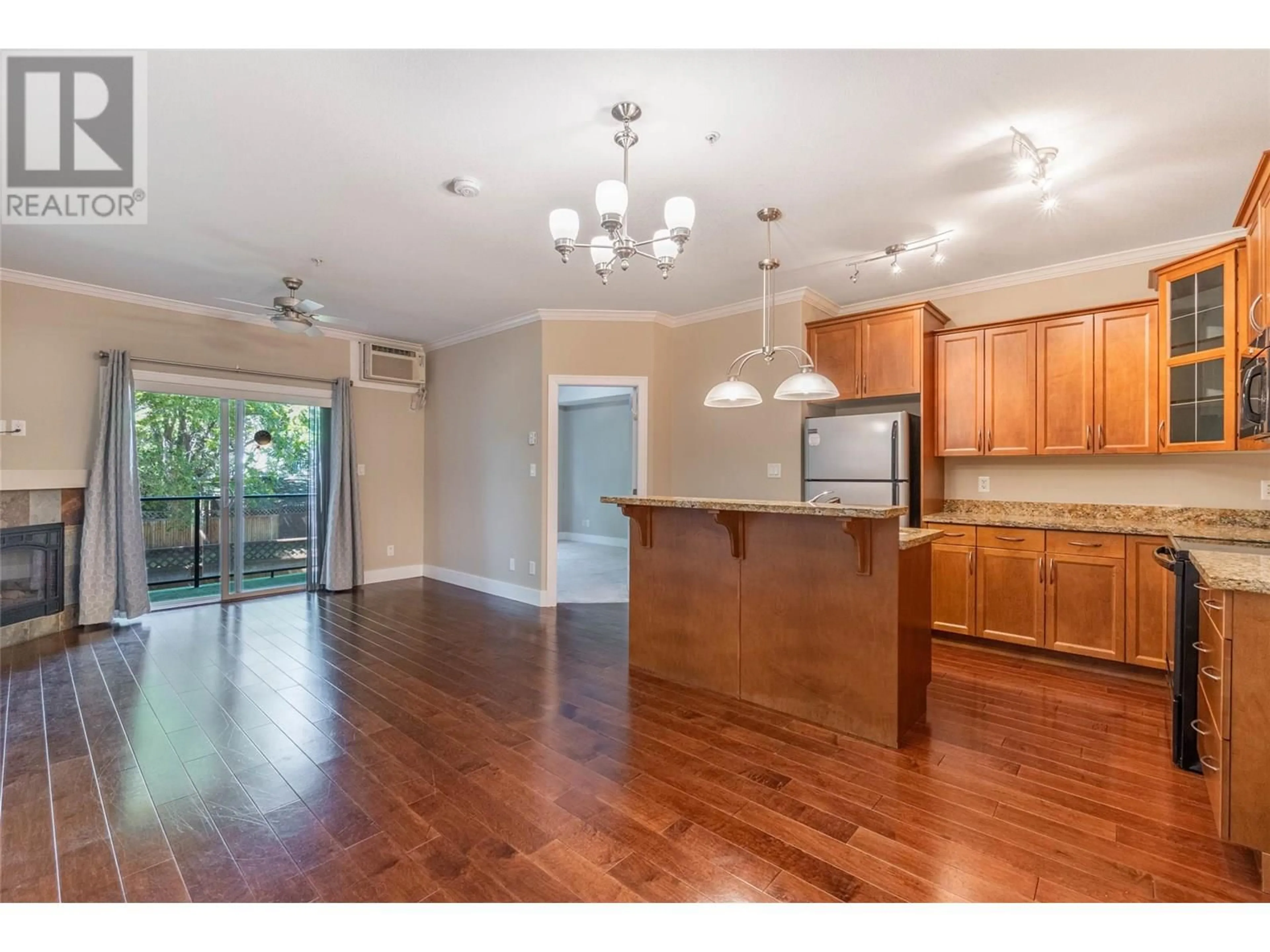 Open concept kitchen, wood/laminate floor for 204 - 240 WADE AVENUE W AVENUE, Penticton British Columbia V2A1T8