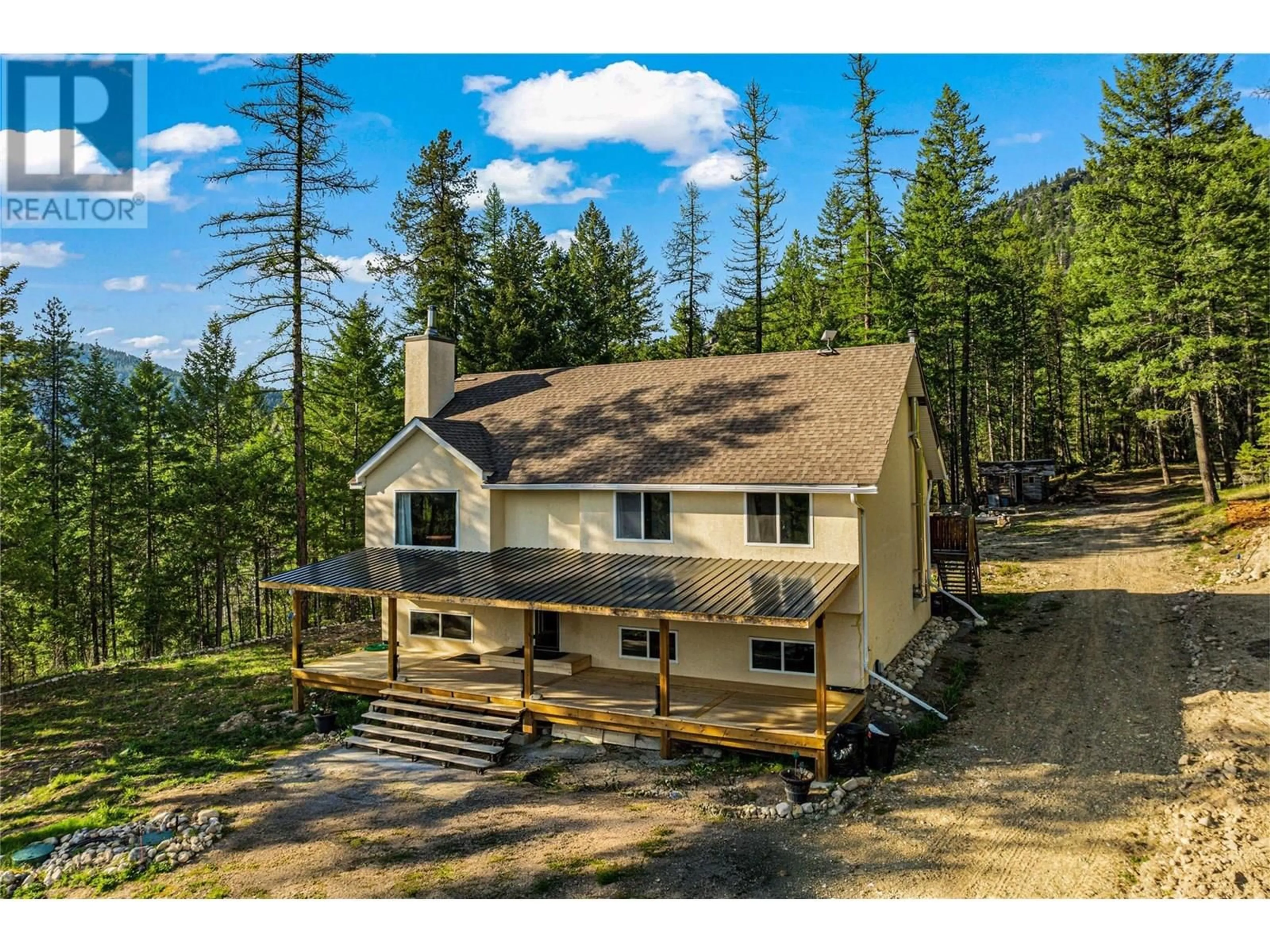 A pic from outside/outdoor area/front of a property/back of a property/a pic from drone, mountain view for 4350 33 HIGHWAY, Beaverdell British Columbia V0H1A0