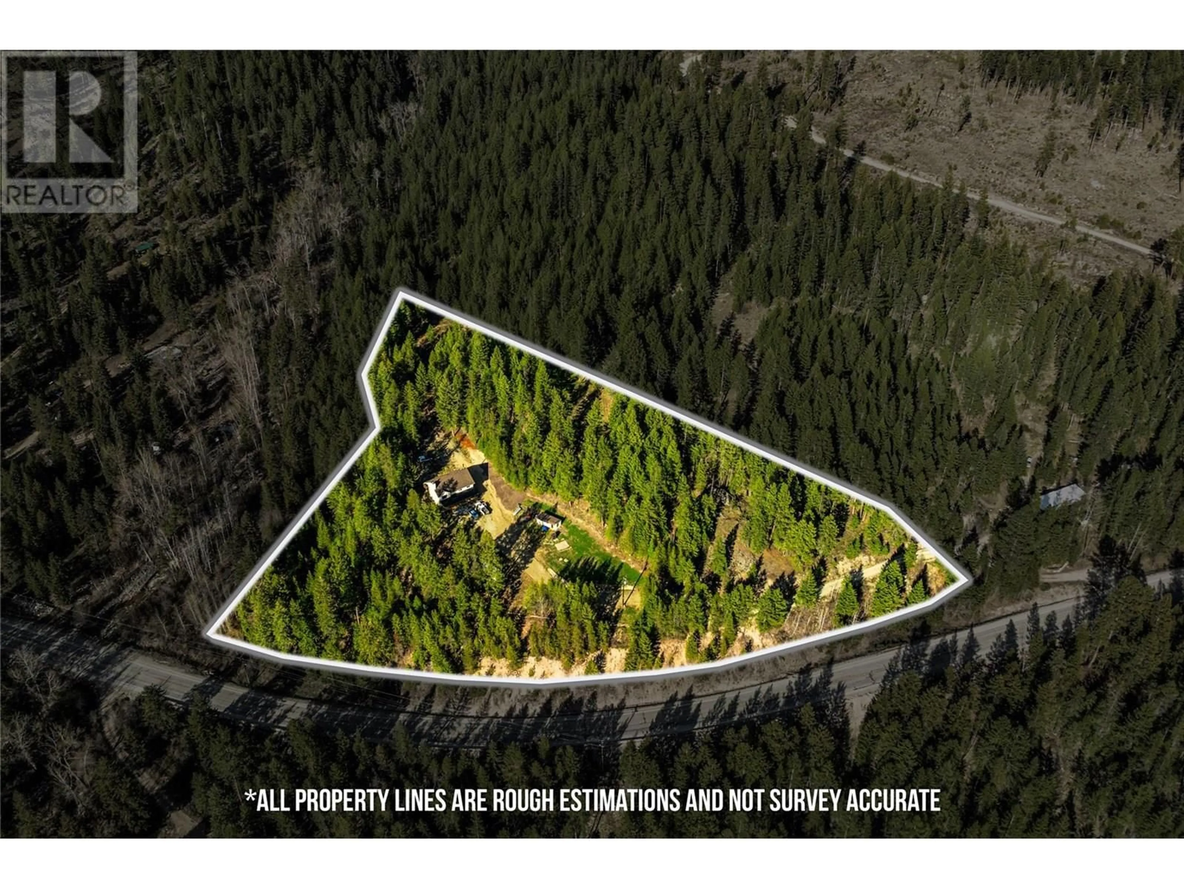 A pic from outside/outdoor area/front of a property/back of a property/a pic from drone, forest/trees view for 4350 33 HIGHWAY, Beaverdell British Columbia V0H1A0