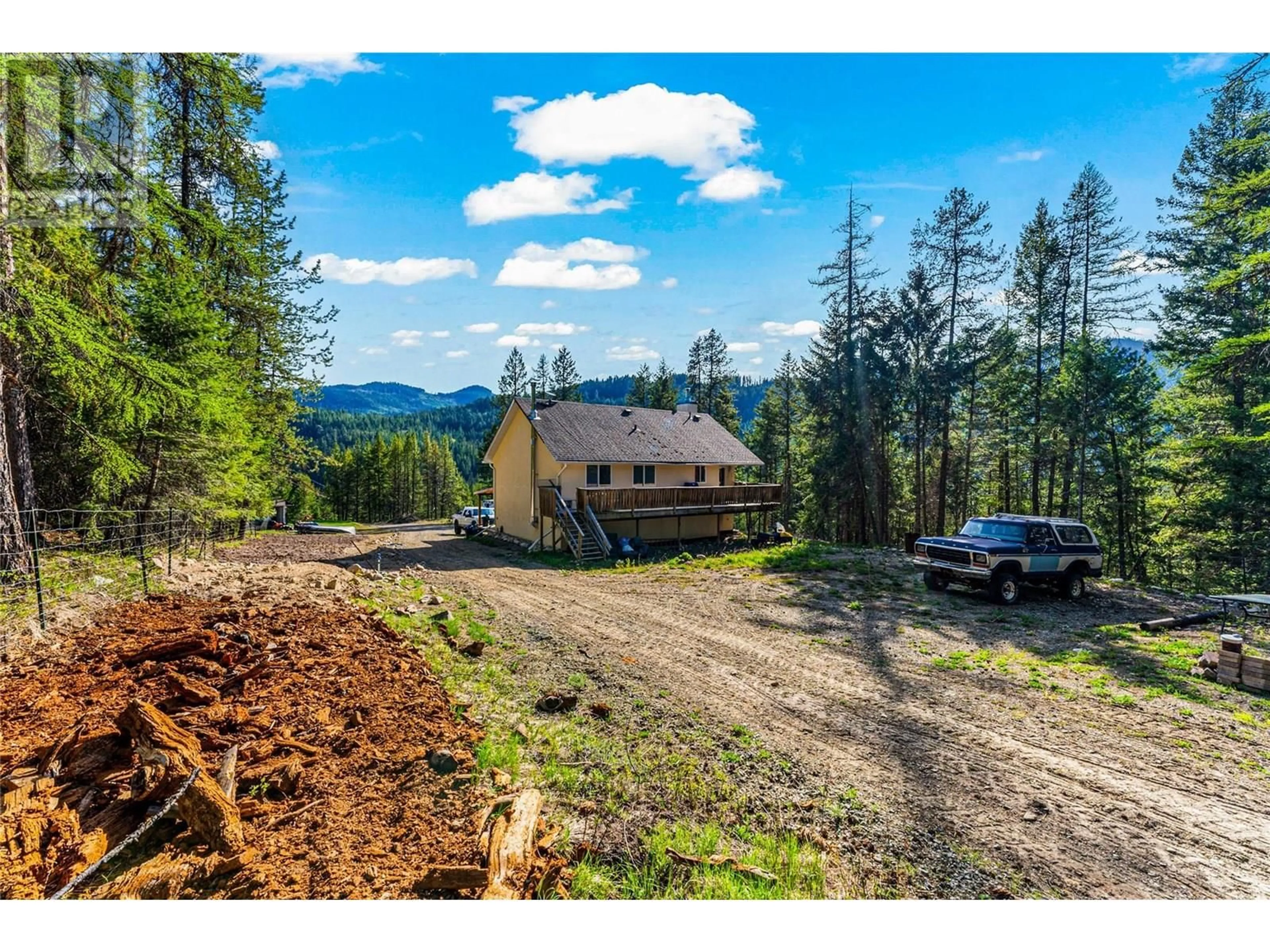 A pic from outside/outdoor area/front of a property/back of a property/a pic from drone, mountain view for 4350 33 HIGHWAY, Beaverdell British Columbia V0H1A0