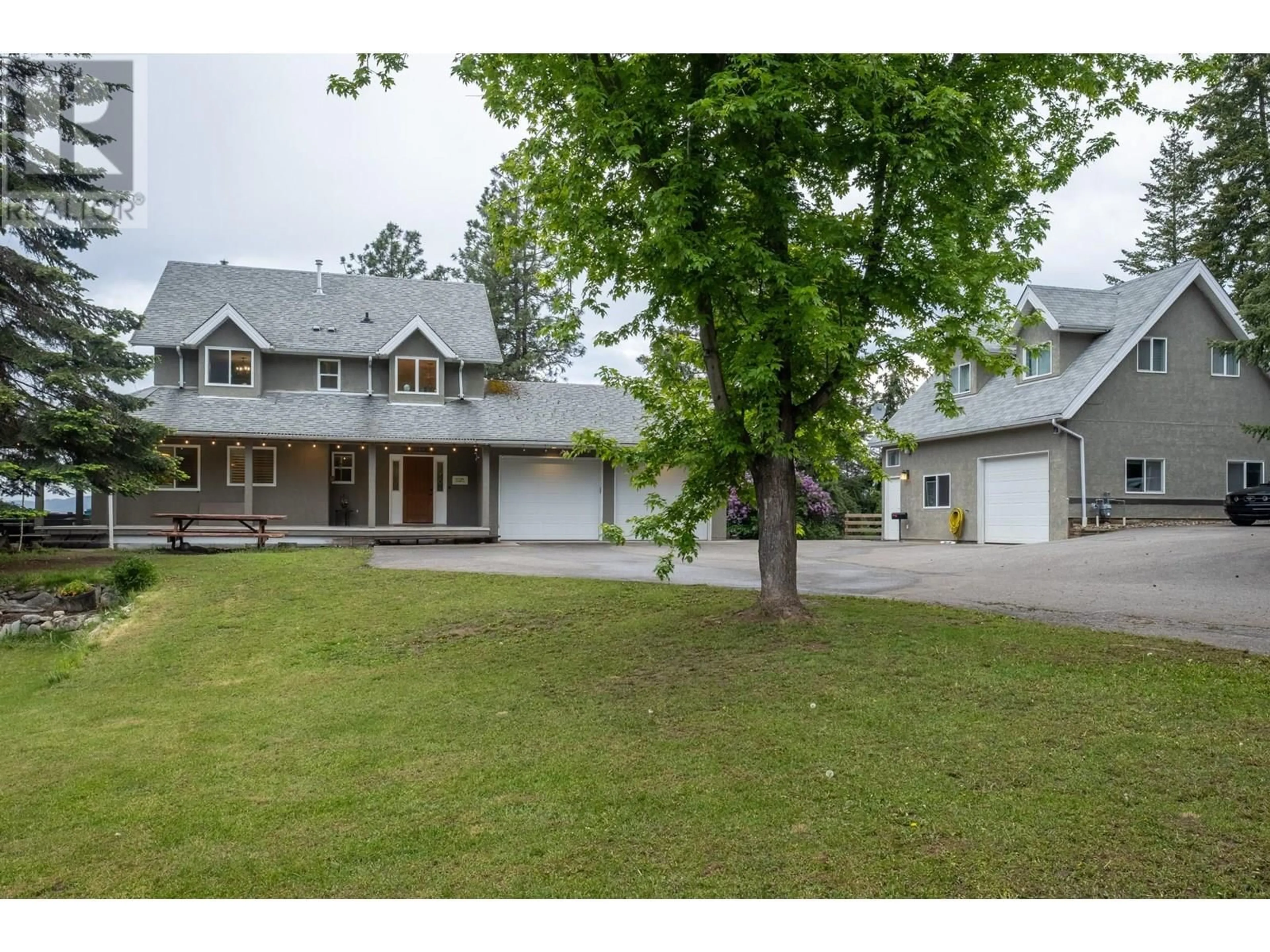 A pic from outside/outdoor area/front of a property/back of a property/a pic from drone, street for 5700 RANCH ROAD, Vernon British Columbia V1B3J9