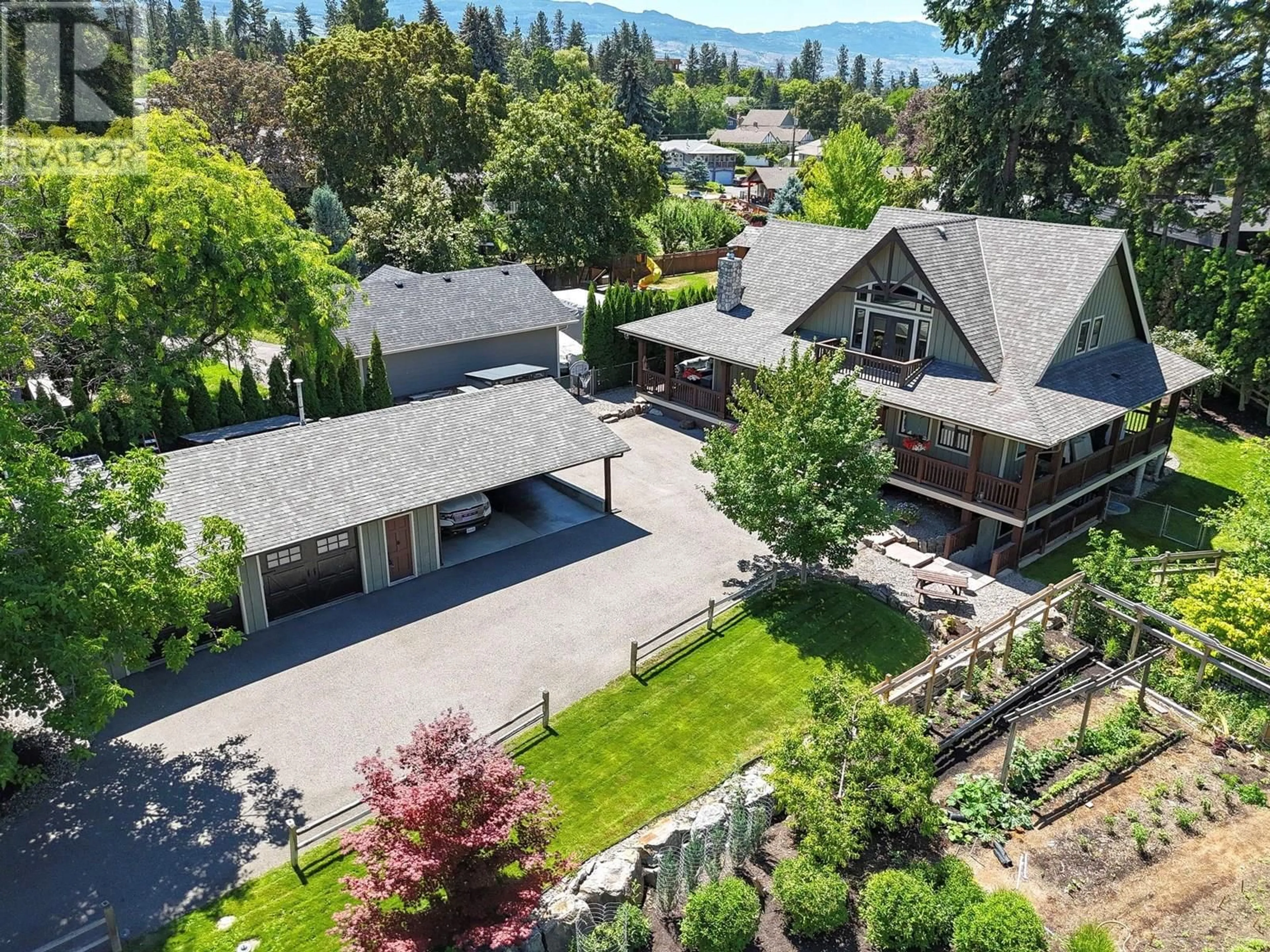 A pic from outside/outdoor area/front of a property/back of a property/a pic from drone, mountain view for 3336 HALL ROAD, Kelowna British Columbia V1W2T2
