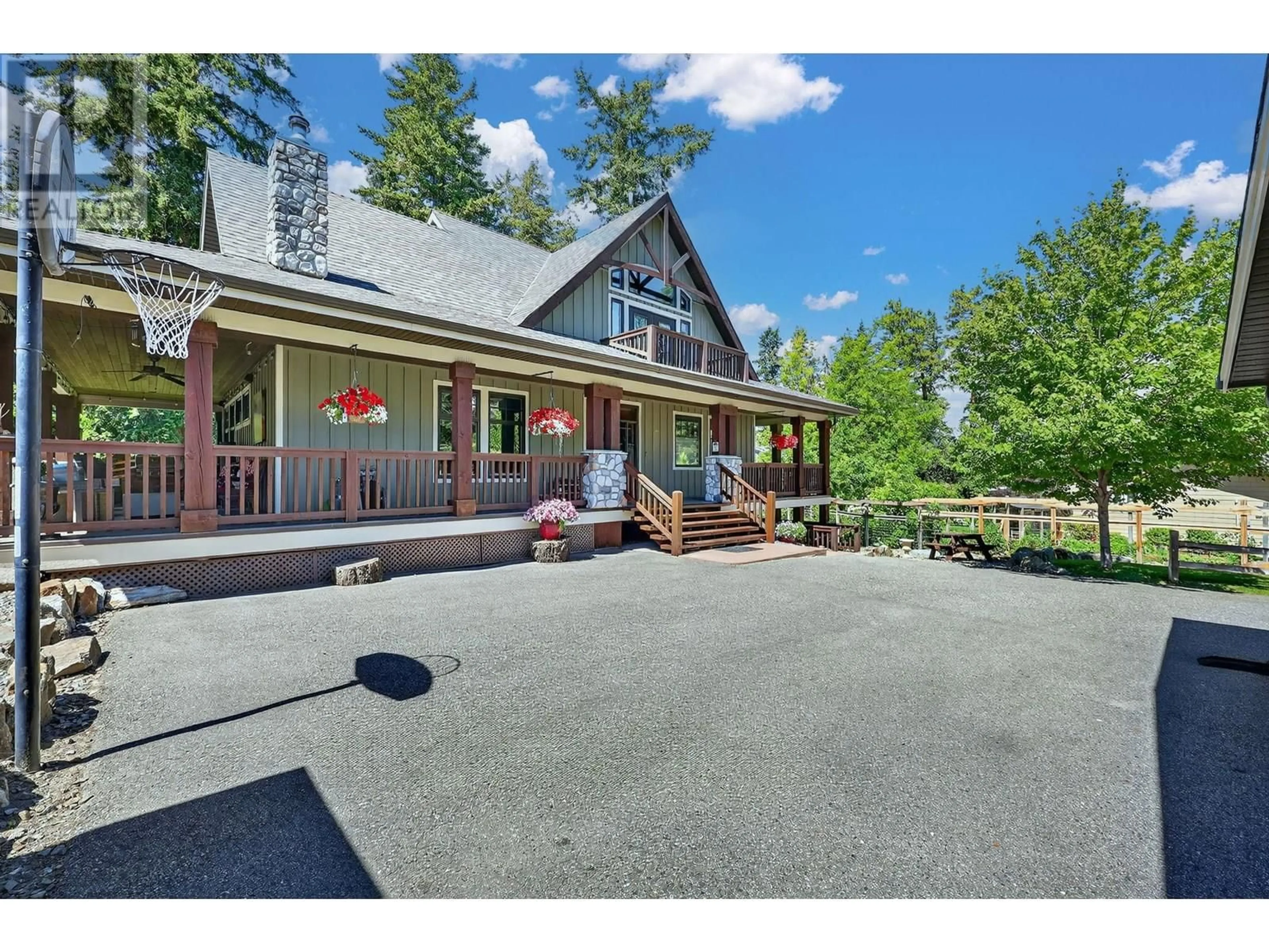 A pic from outside/outdoor area/front of a property/back of a property/a pic from drone, mountain view for 3336 HALL ROAD, Kelowna British Columbia V1W2T2