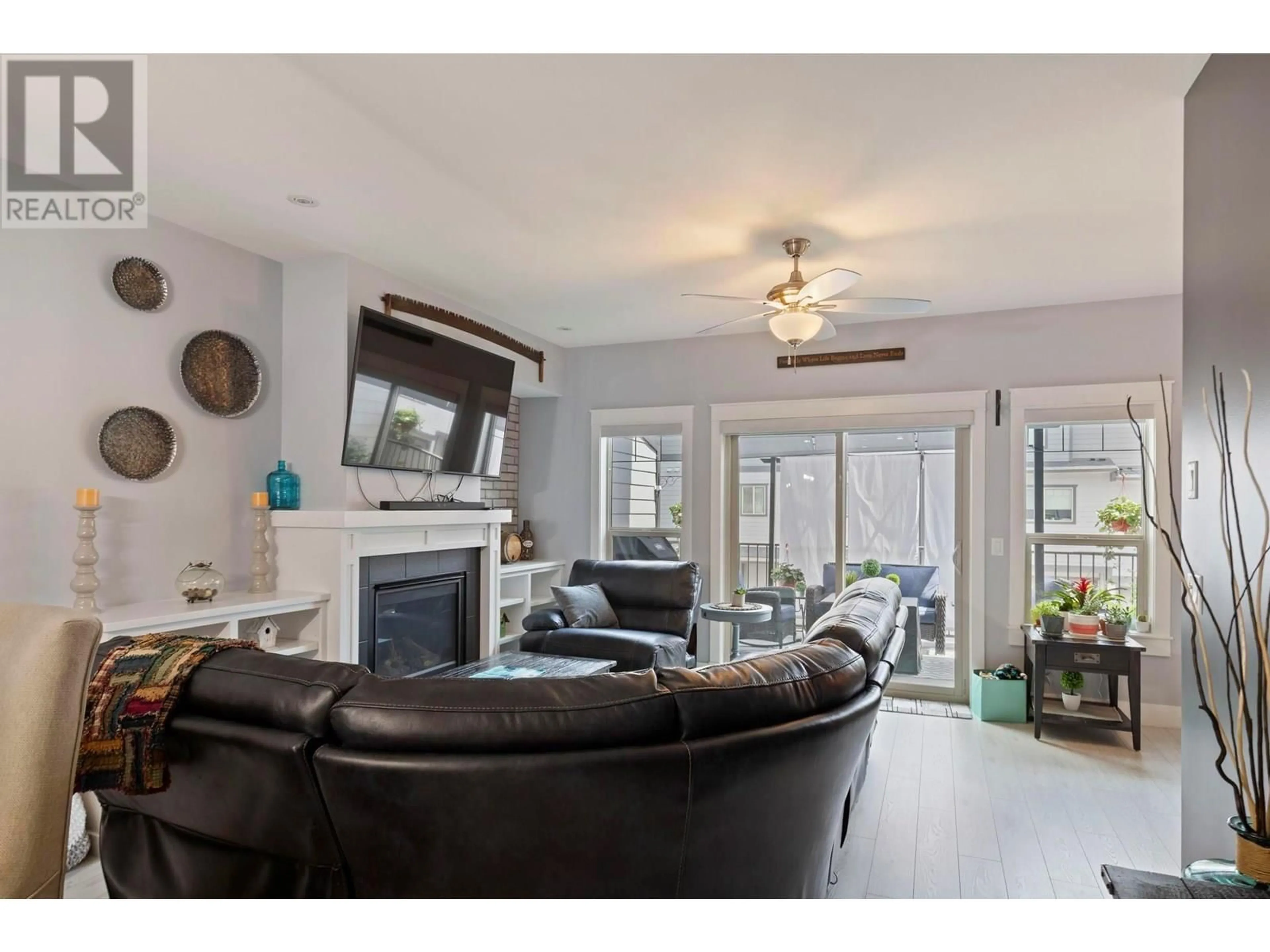 Living room with furniture, wood/laminate floor for 45 - 3359 COUGAR ROAD, Westbank British Columbia V4T3G1