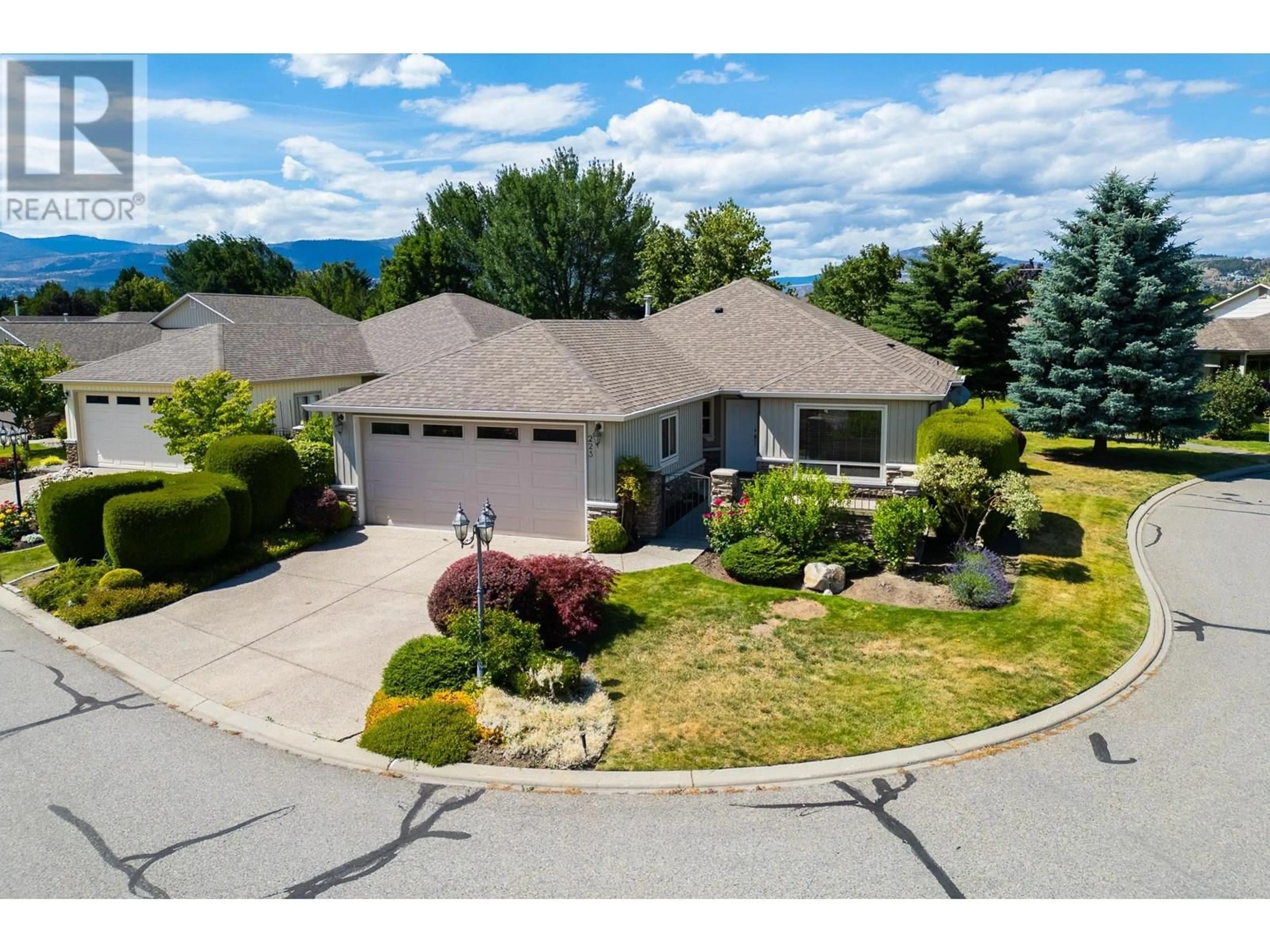 A pic from outside/outdoor area/front of a property/back of a property/a pic from drone, mountain view for 223 - 2365 STILLINGFLEET ROAD, Kelowna British Columbia V1W4X5
