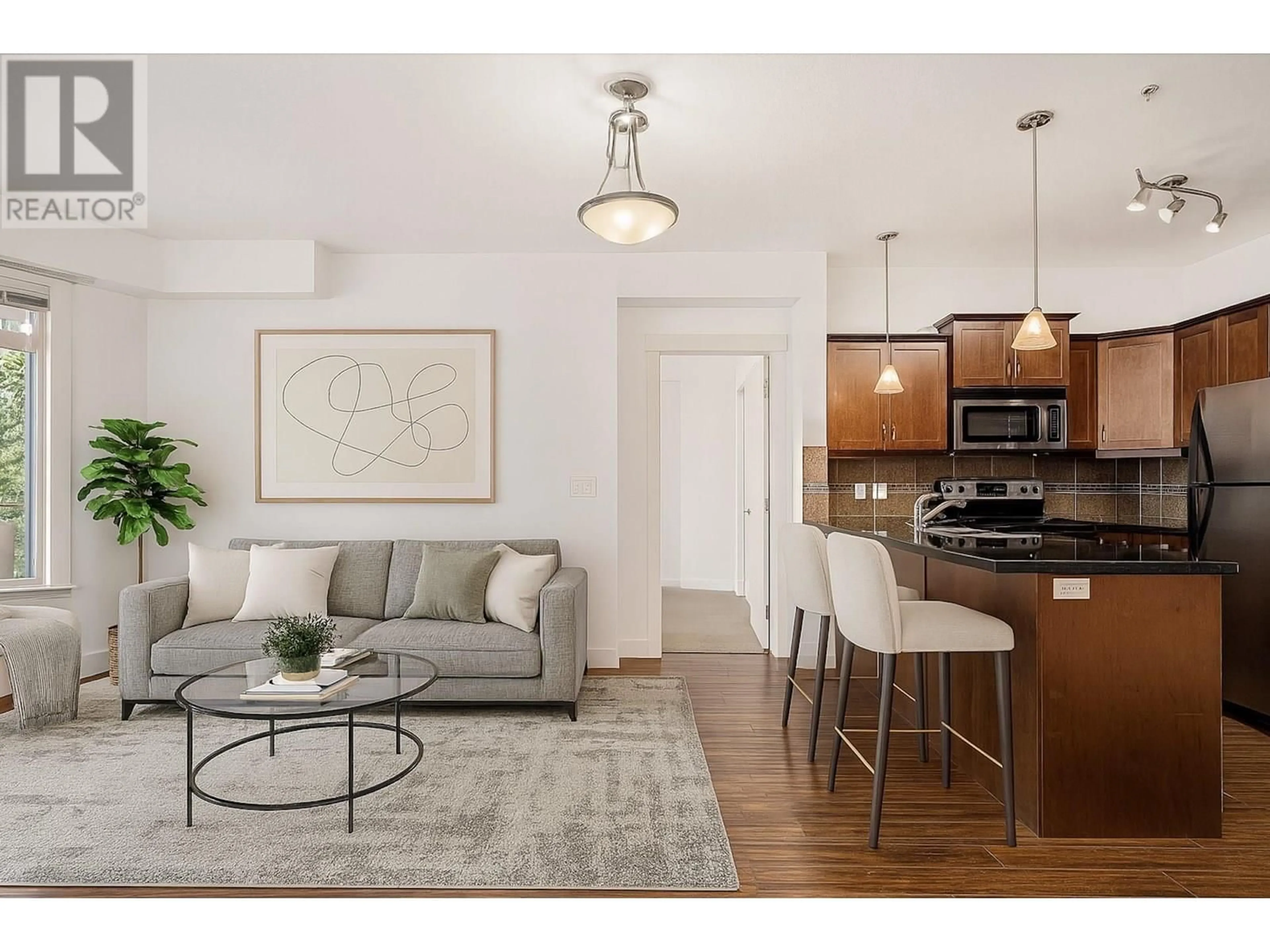 Living room with furniture, wood/laminate floor for 215 - 3533 CARRINGTON ROAD, West Kelowna British Columbia V4T2Z9