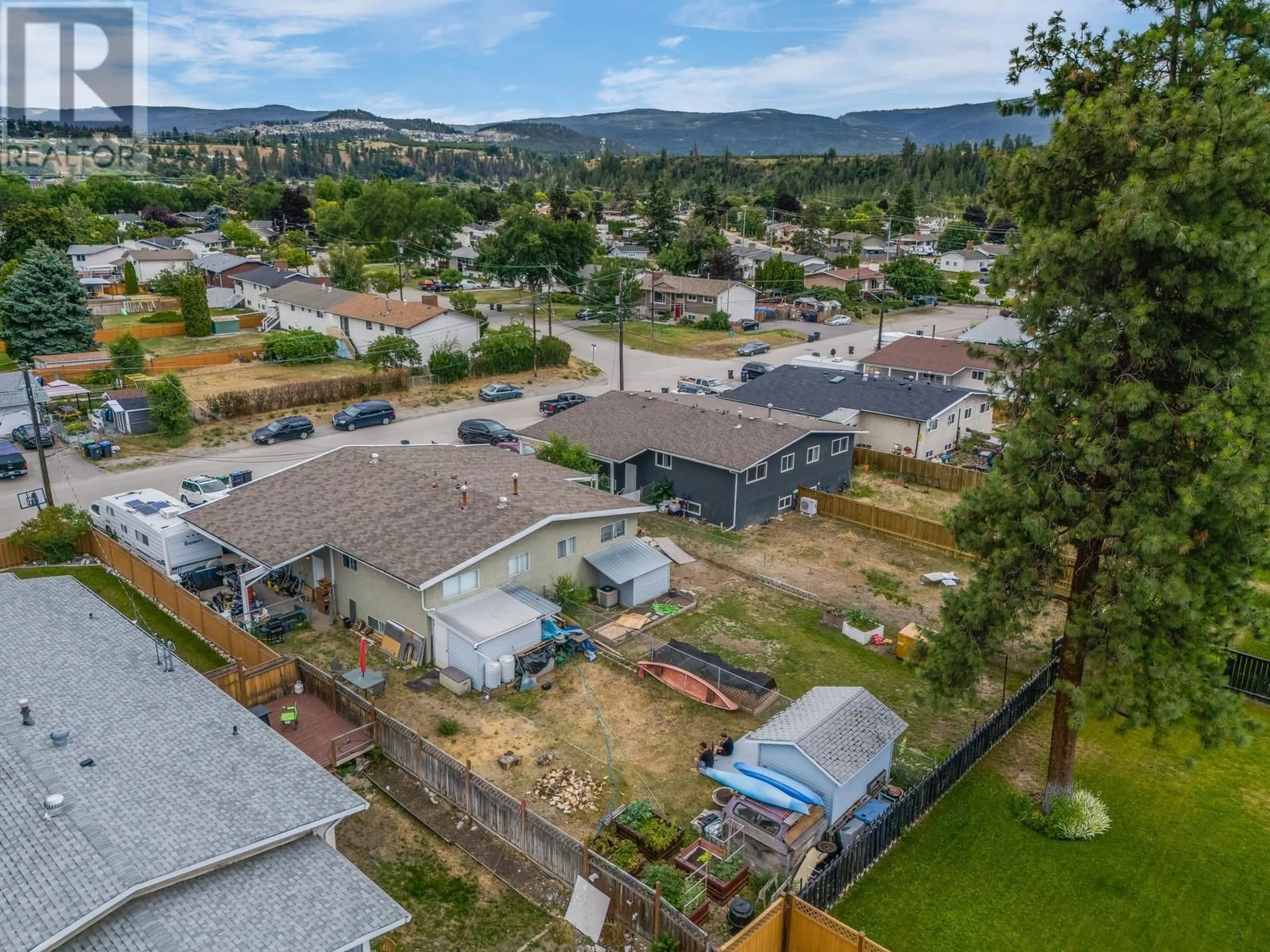 A pic from outside/outdoor area/front of a property/back of a property/a pic from drone, mountain view for 830/832 IRMA ROAD, Kelowna British Columbia V1X3Z9