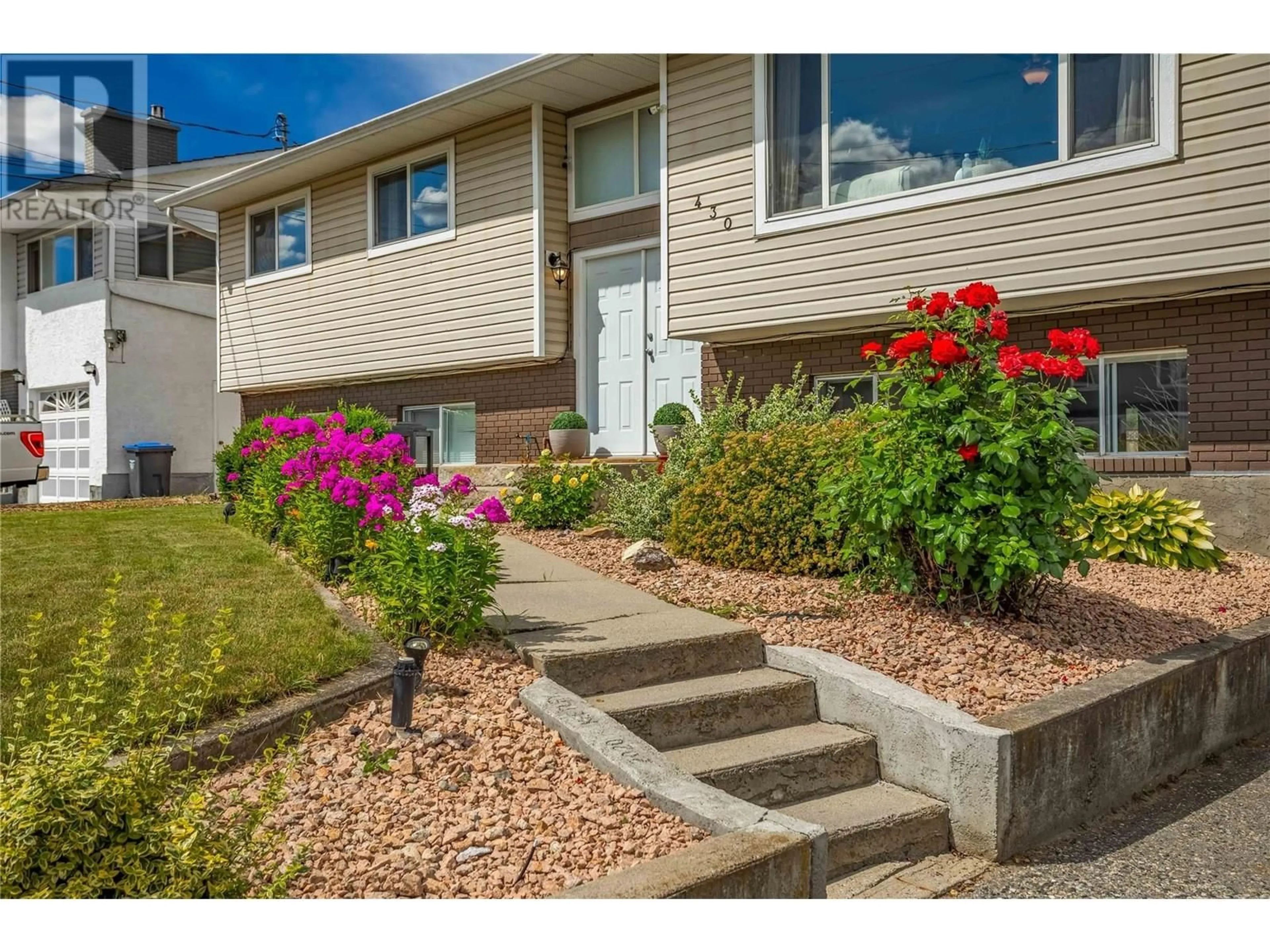 Home with vinyl exterior material, street for 430 MOLNAR ROAD, Kelowna British Columbia V1X5H6