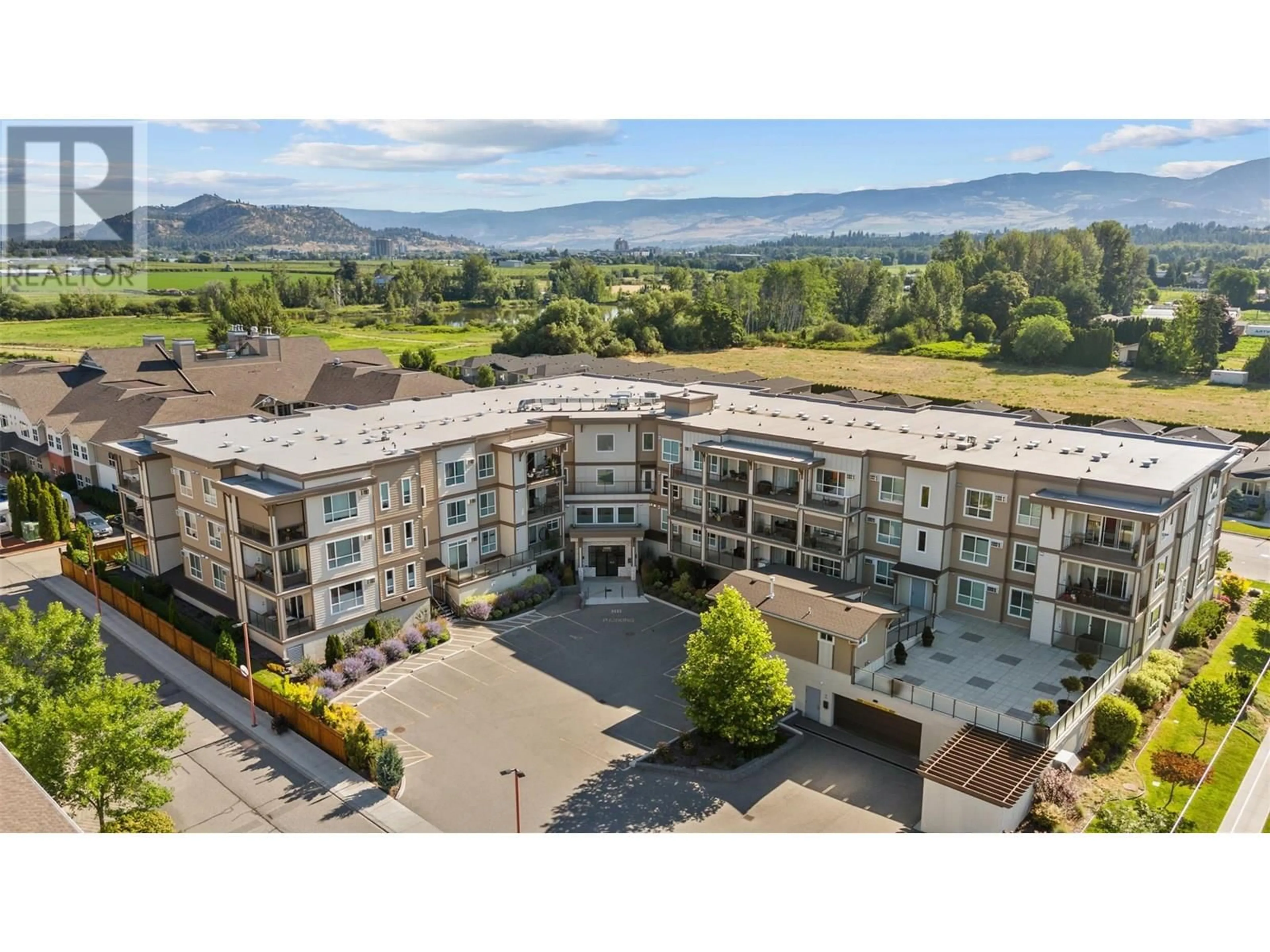 A pic from outside/outdoor area/front of a property/back of a property/a pic from drone, mountain view for 313 - 3090 BURTCH ROAD, Kelowna British Columbia V1W5G9