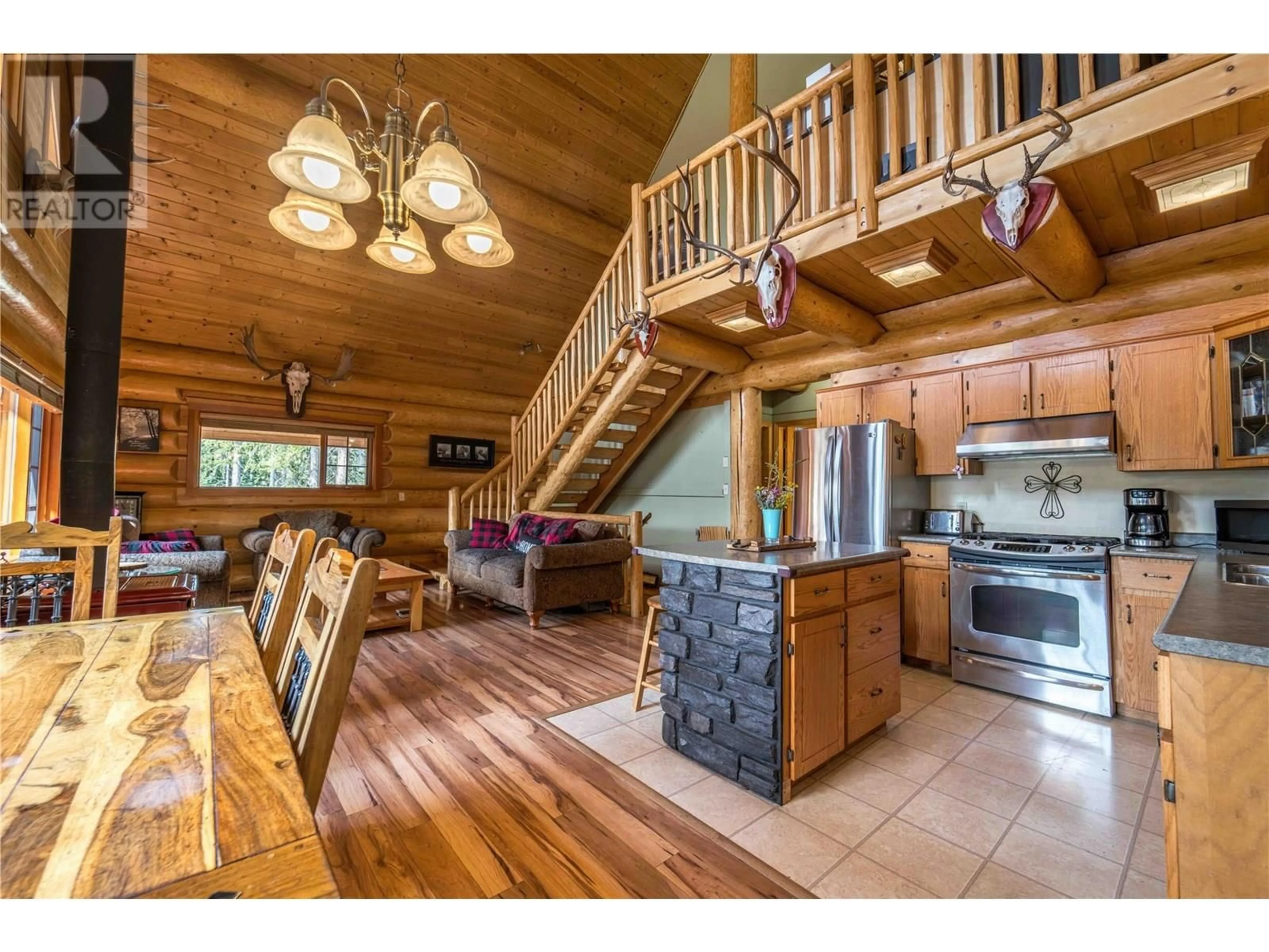 Open concept kitchen, wood/laminate floor for 4730 PINE RIDGE WAY, Logan Lake British Columbia V0K1W0