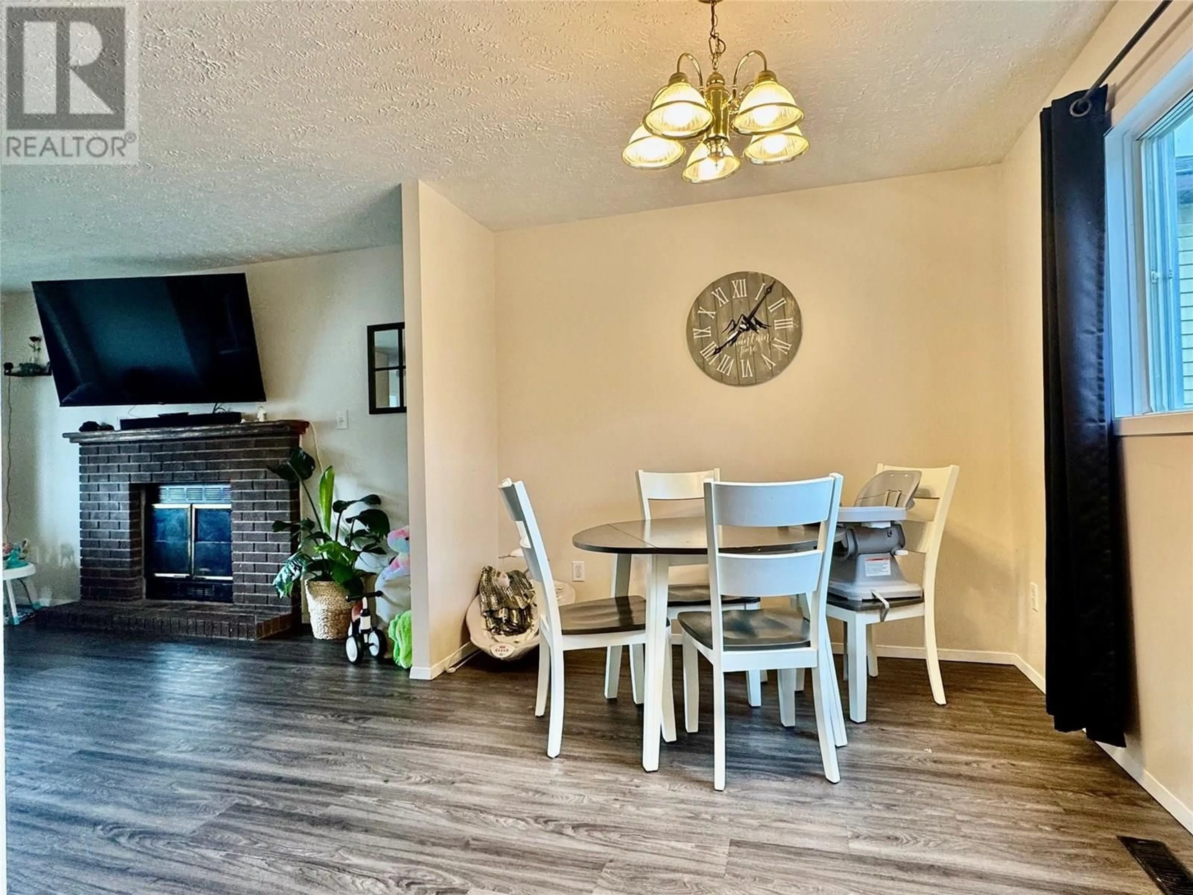 Dining room, wood/laminate floor for 128 FELLERS AVENUE, Tumbler Ridge British Columbia V0C2W0
