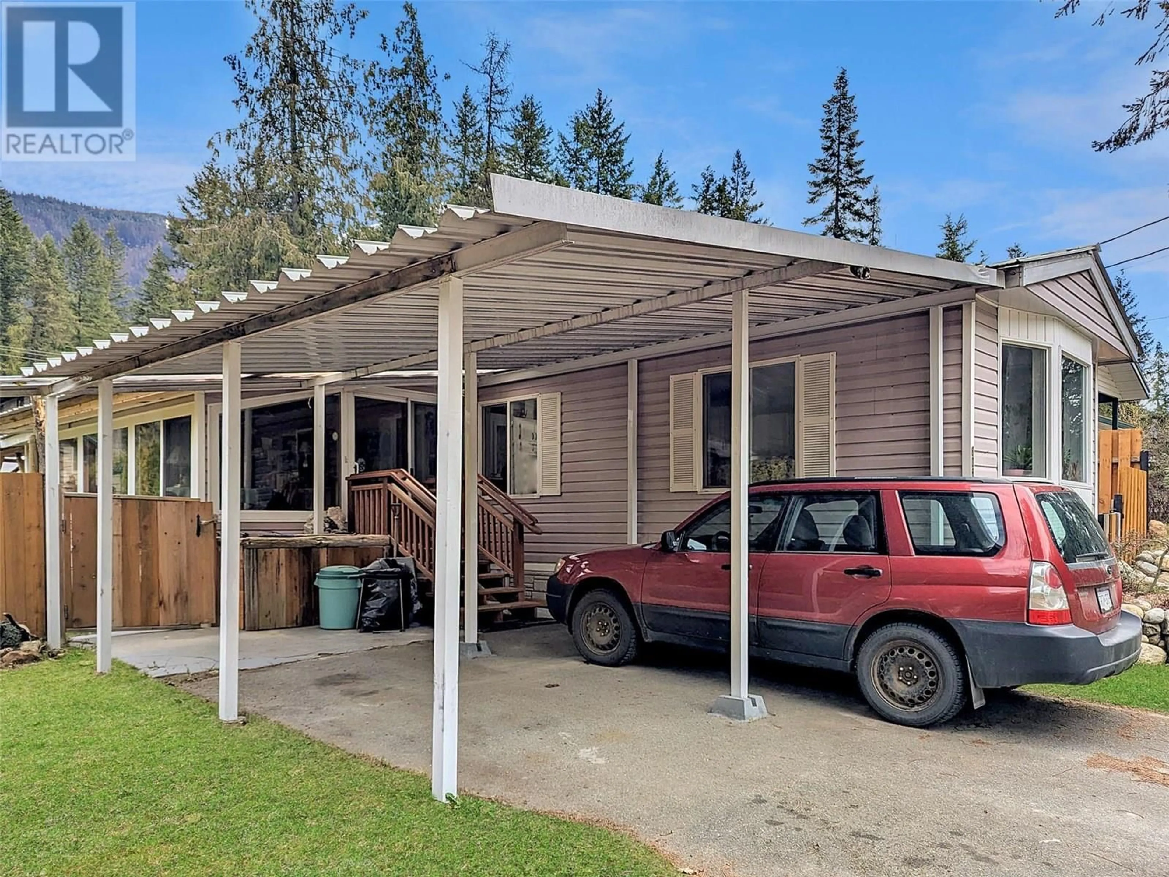 Home with vinyl exterior material, street for 808 NELSON STREET, Slocan British Columbia V0G2C0