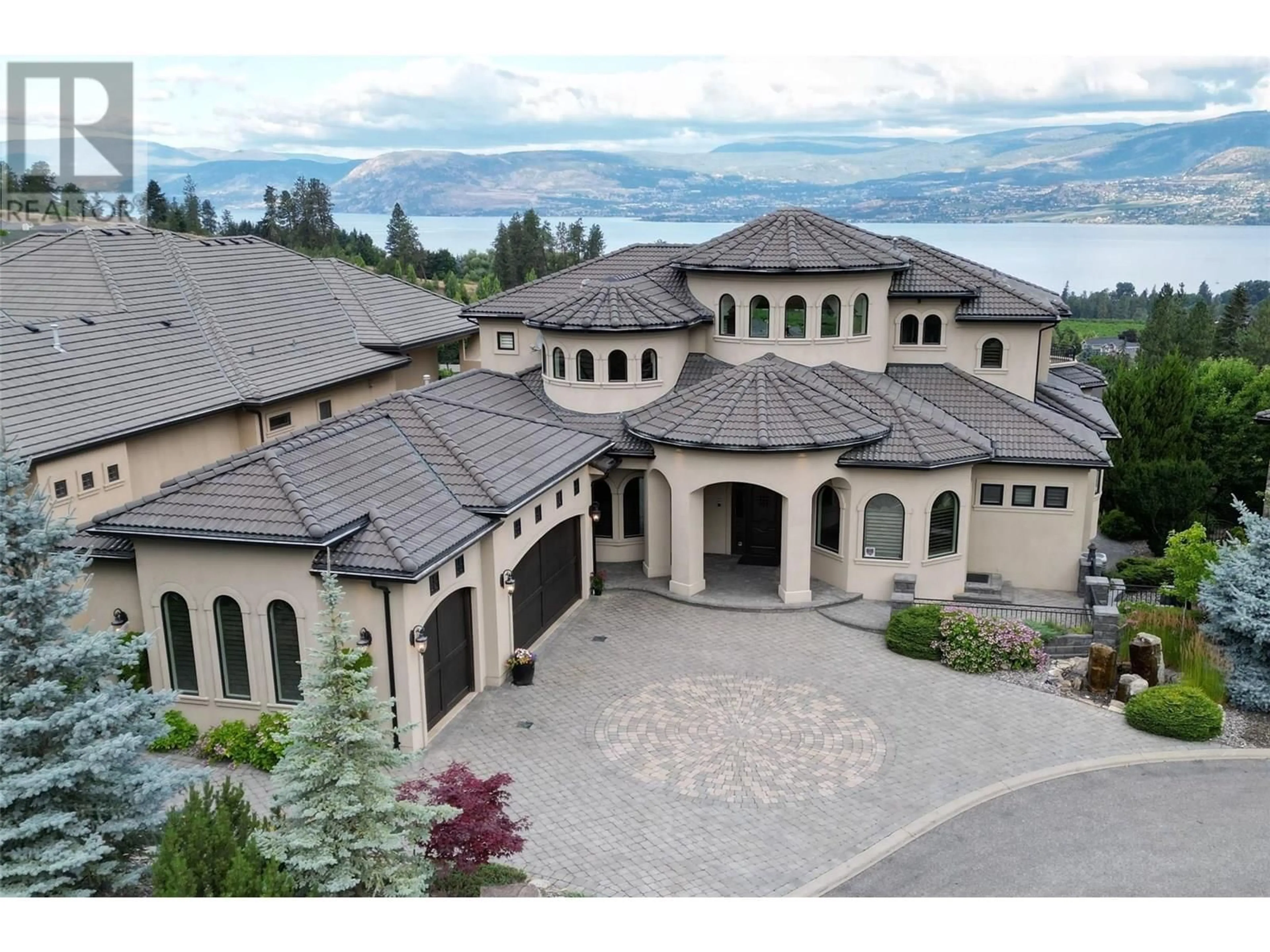 A pic from outside/outdoor area/front of a property/back of a property/a pic from drone, mountain view for 4860 TUSCANY LANE, Kelowna British Columbia V1W5H3