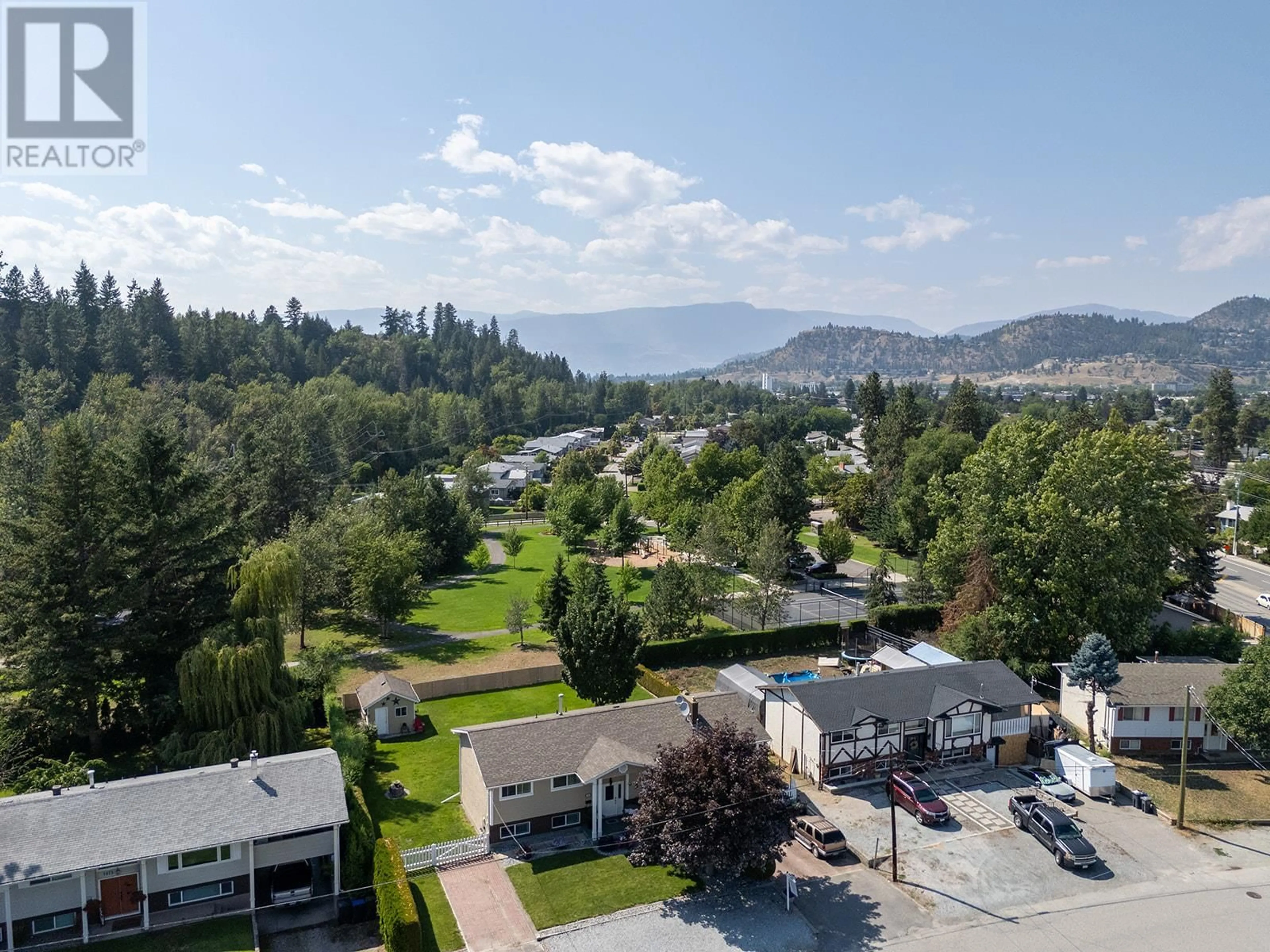 A pic from outside/outdoor area/front of a property/back of a property/a pic from drone, mountain view for 1085 TAMARACK DRIVE, Kelowna British Columbia V1X1E3
