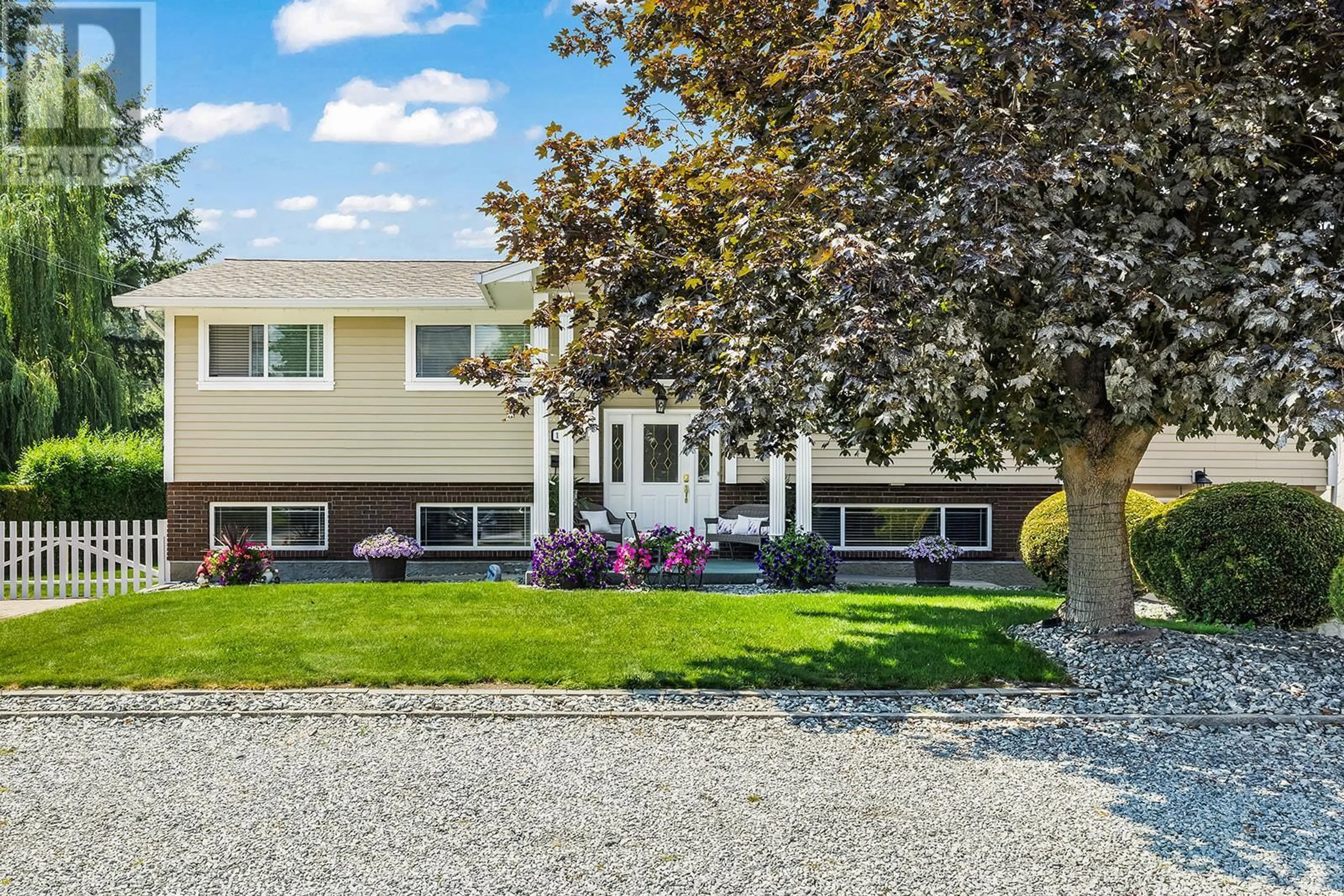 Home with vinyl exterior material, street for 1085 TAMARACK DRIVE, Kelowna British Columbia V1X1E3