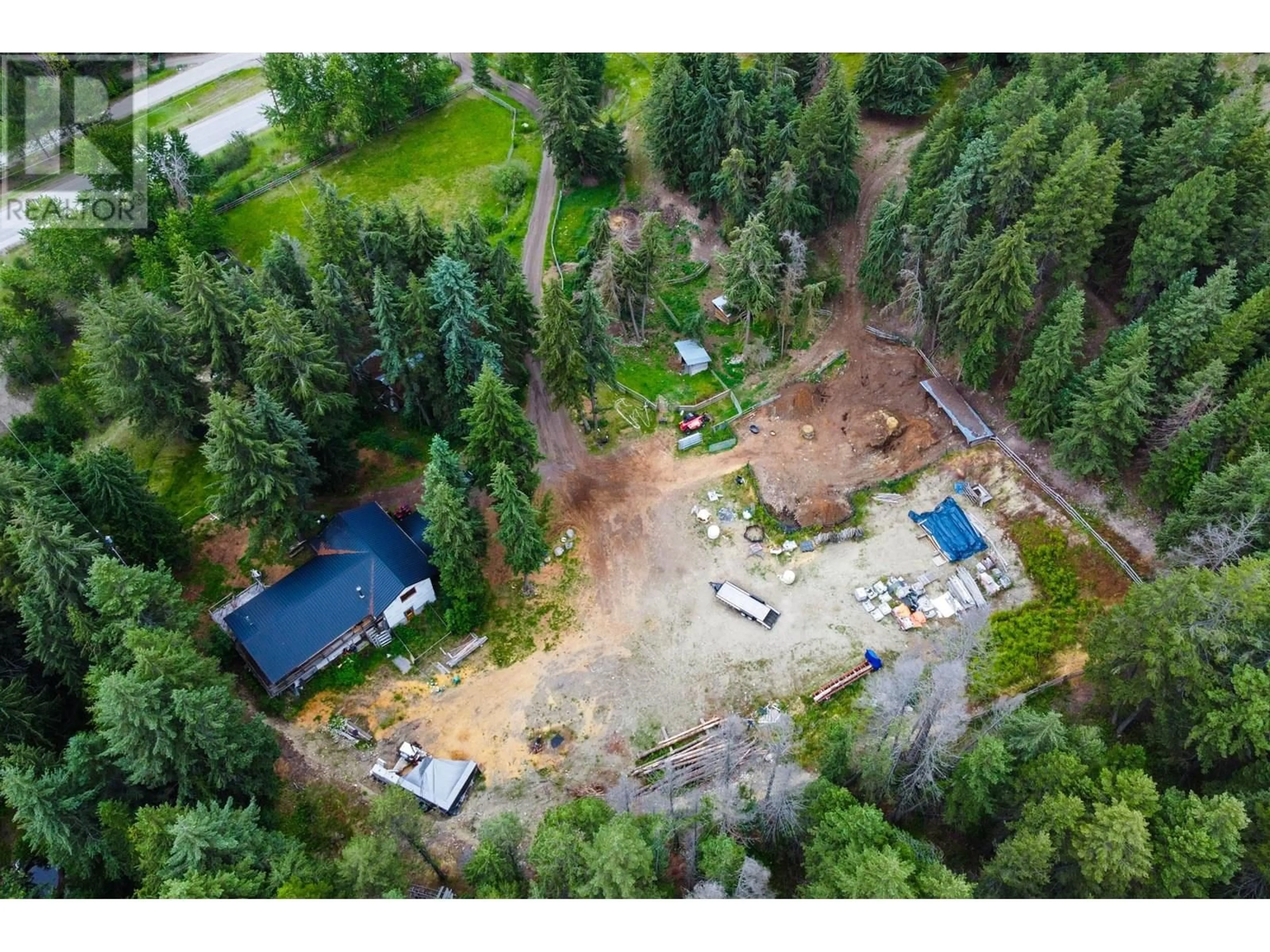 A pic from outside/outdoor area/front of a property/back of a property/a pic from drone, forest/trees view for 8600 33 HIGHWAY, Kelowna British Columbia V1P1J4