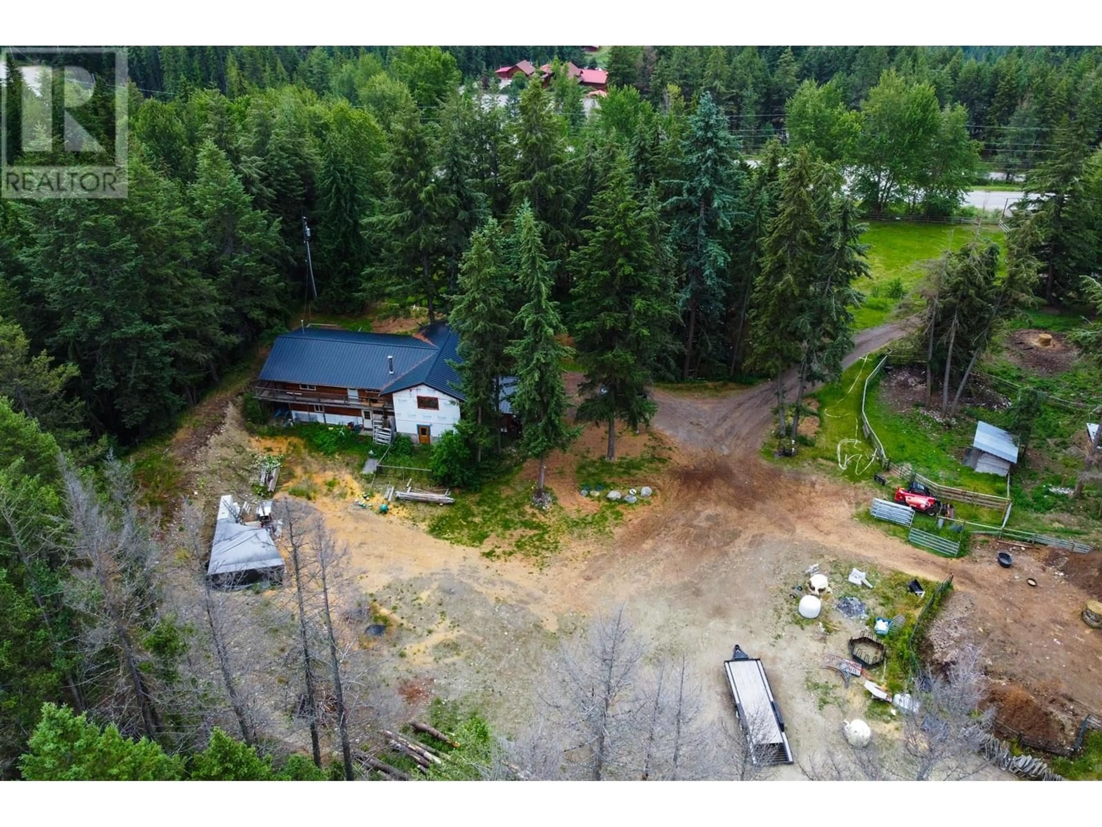 A pic from outside/outdoor area/front of a property/back of a property/a pic from drone, forest/trees view for 8600 33 HIGHWAY, Kelowna British Columbia V1P1J4