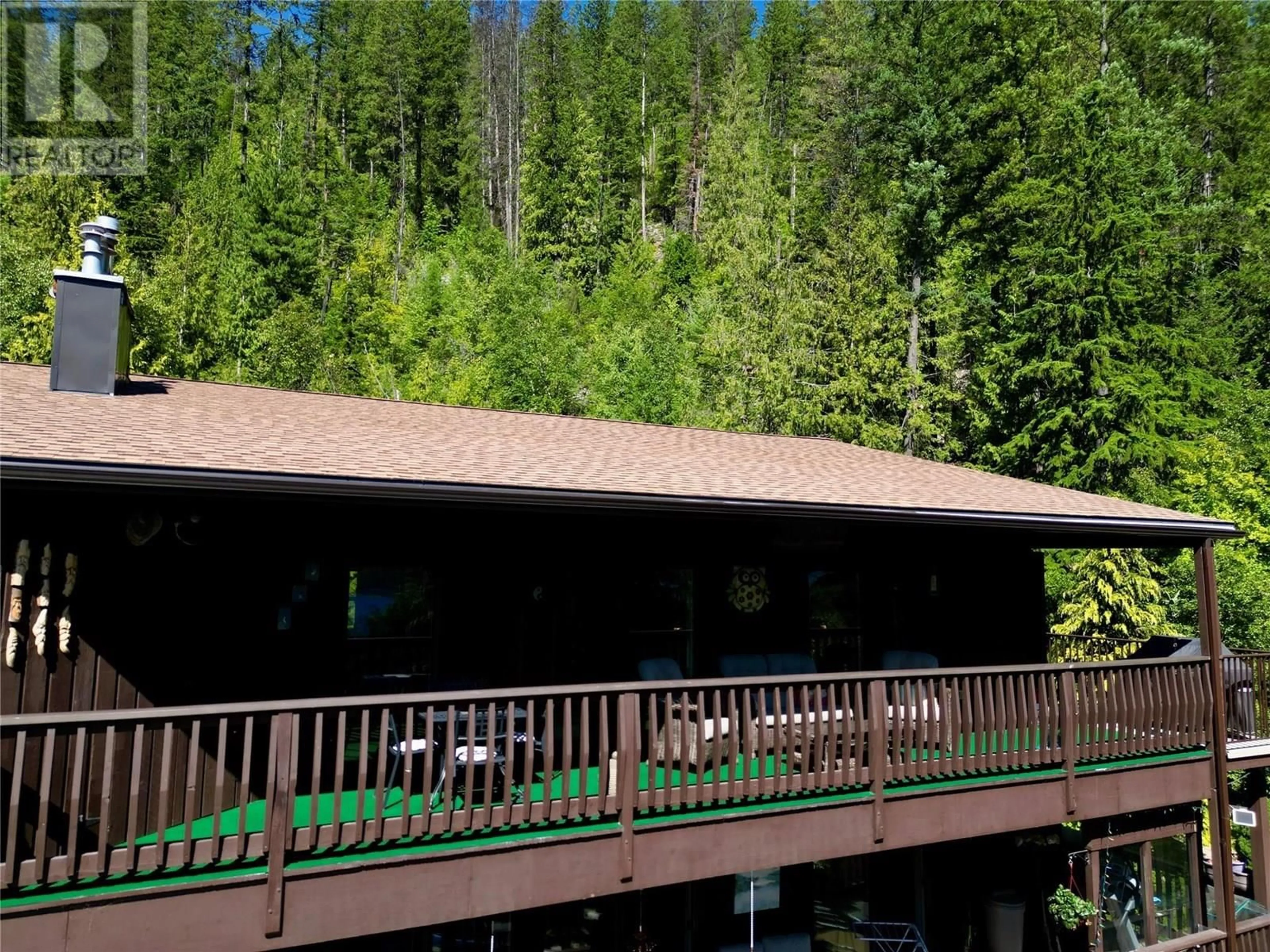 A pic from outside/outdoor area/front of a property/back of a property/a pic from drone, forest/trees view for 32 - 1691 3A HIGHWAY, Nelson British Columbia V1L6J8