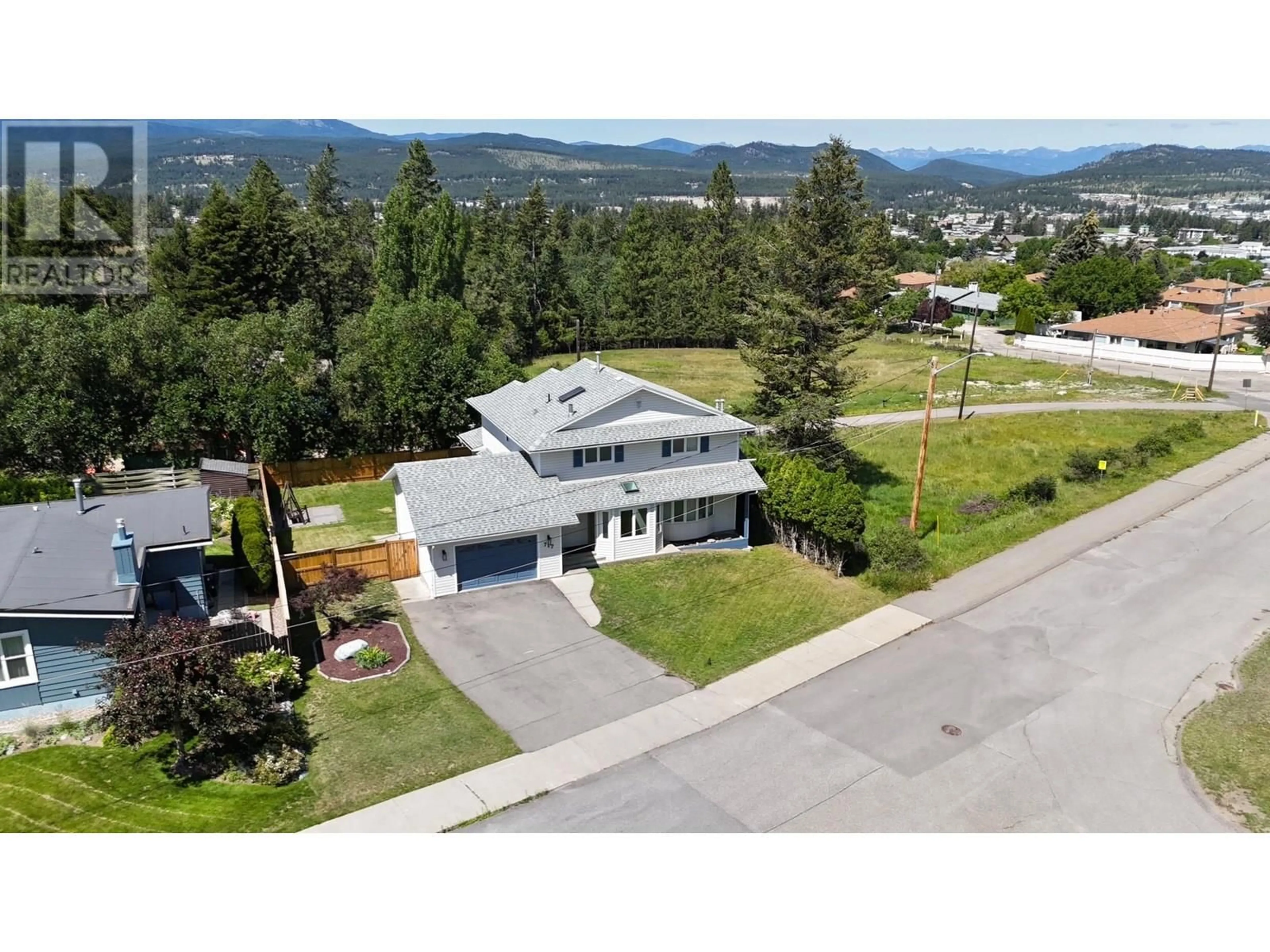 A pic from outside/outdoor area/front of a property/back of a property/a pic from drone, mountain view for 717 27TH AVENUE SOUTH, Cranbrook British Columbia V1C3J6