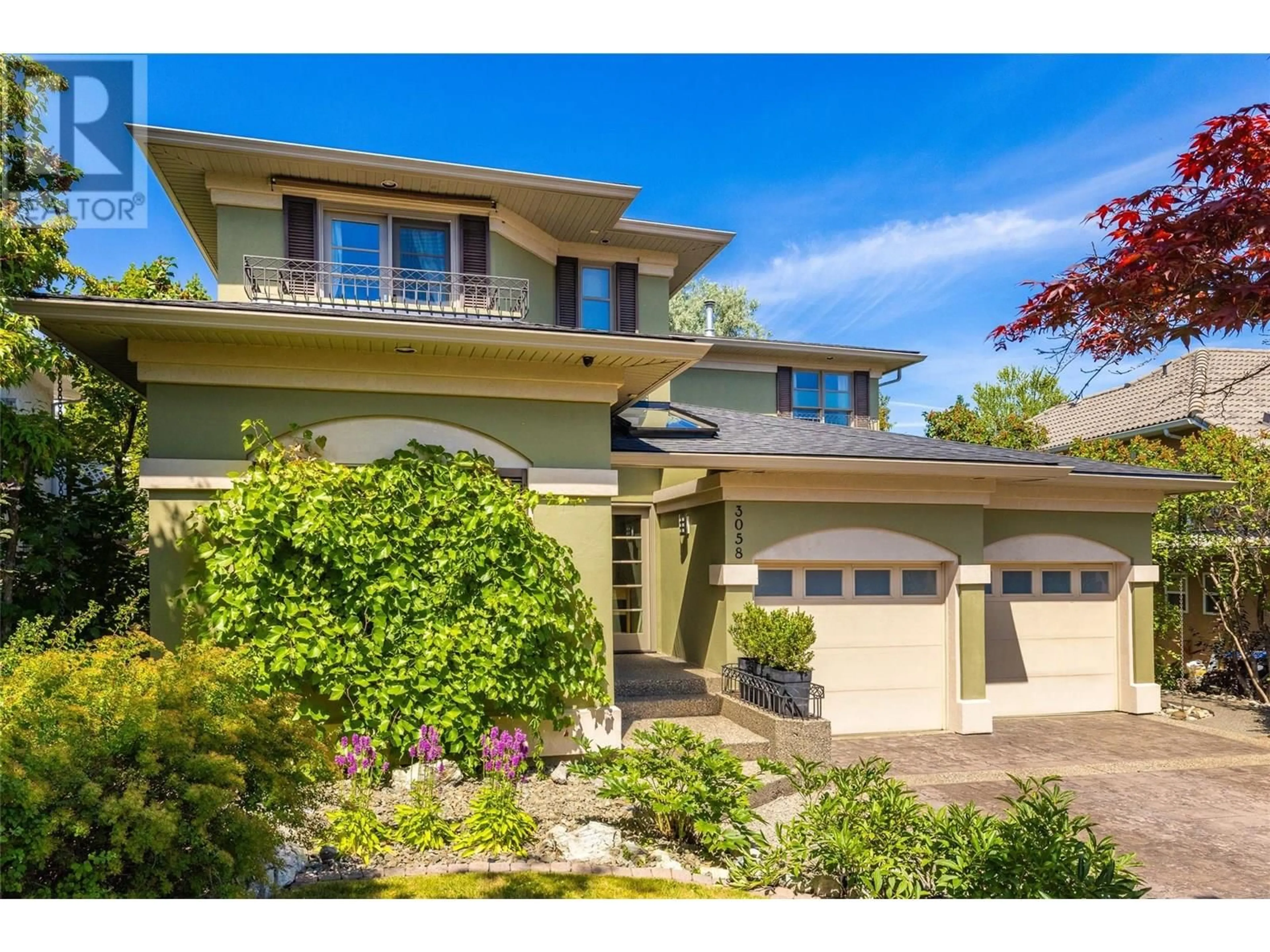 Home with vinyl exterior material, street for 3058 QUAIL RUN DRIVE, Kelowna British Columbia V1V1Z7
