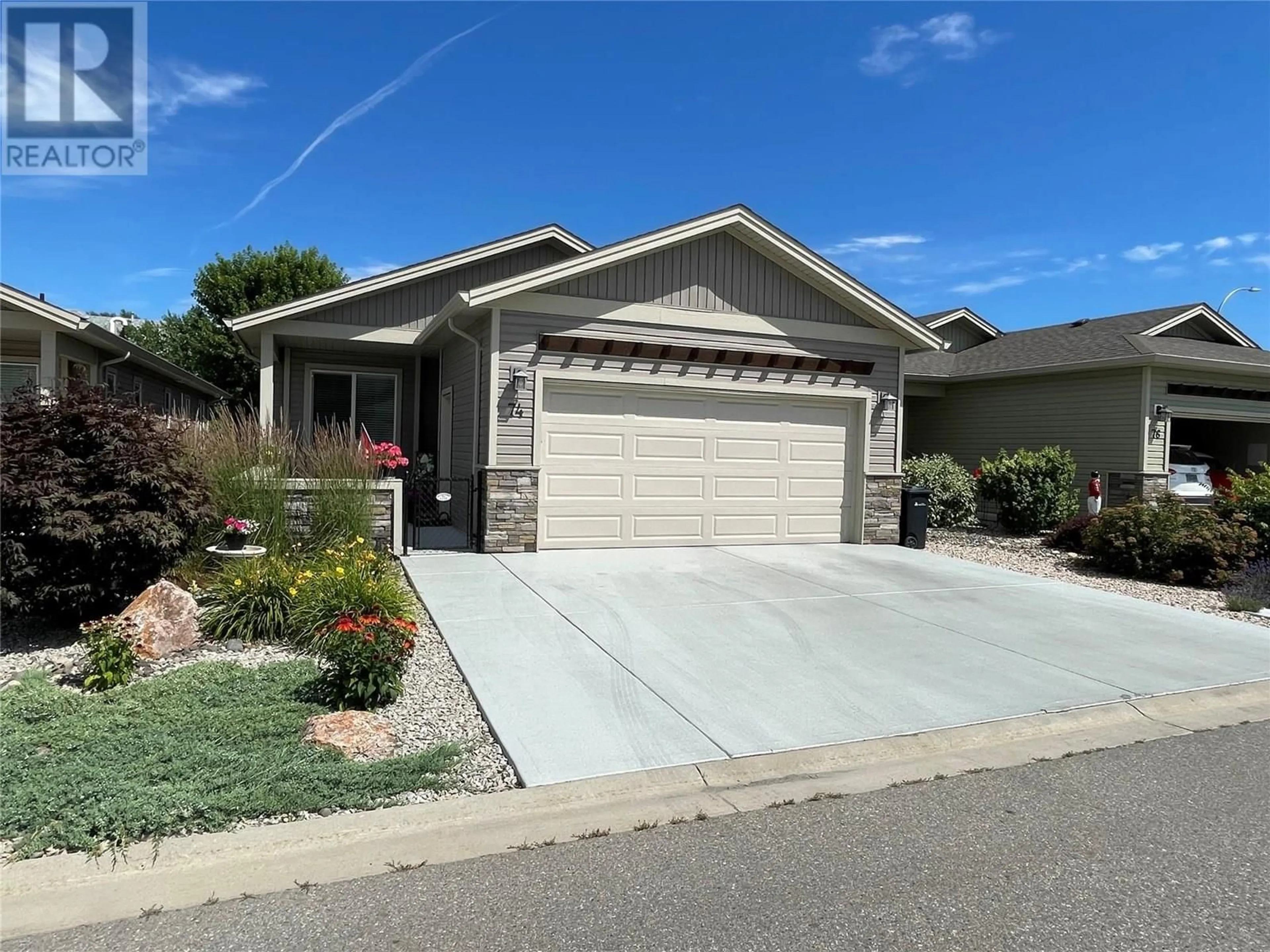 Home with vinyl exterior material, street for 74 - 2100 55 AVENUE, Vernon British Columbia V1T9Y6