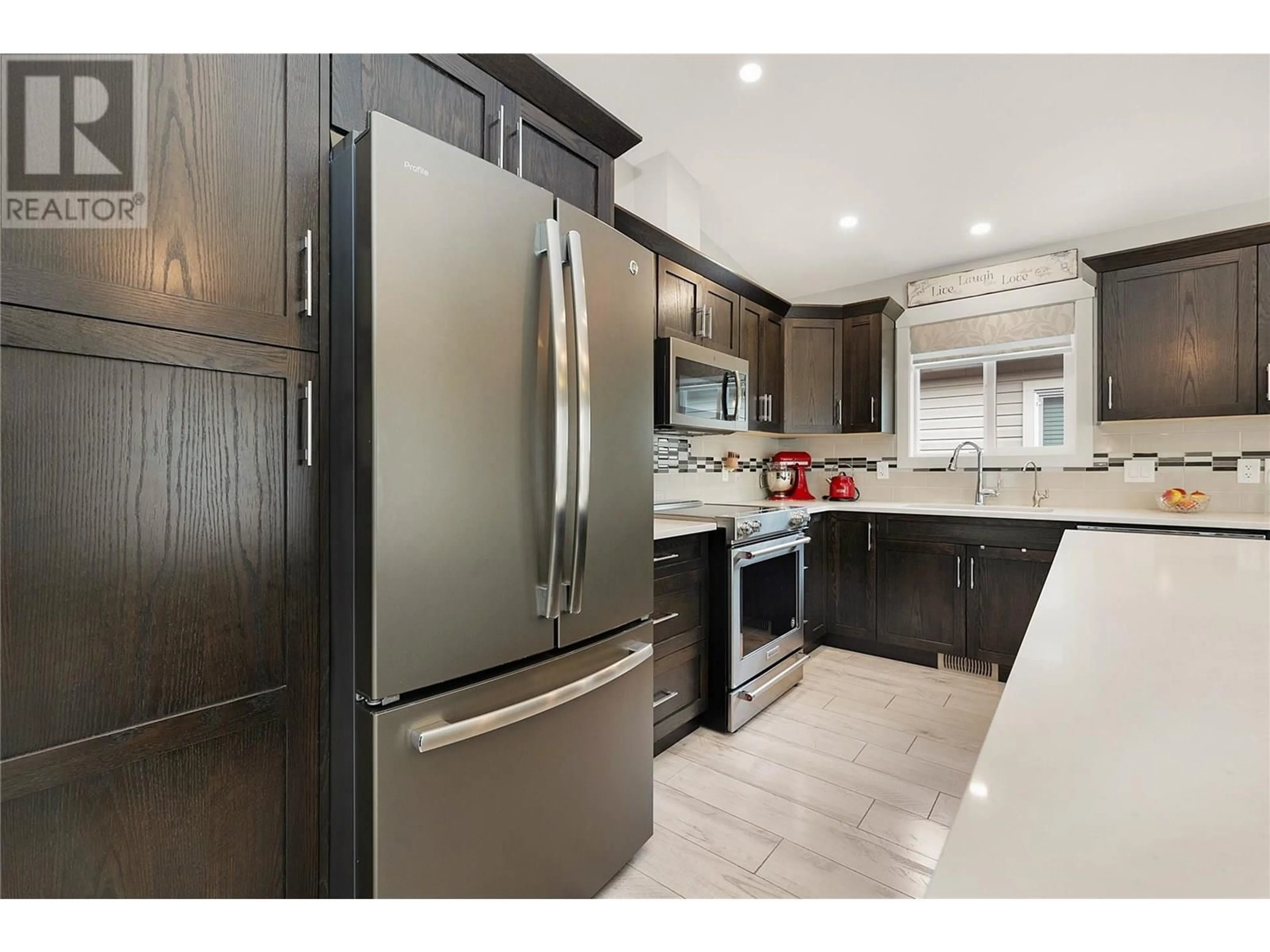Open concept kitchen, ceramic/tile floor for 74 - 2100 55 AVENUE, Vernon British Columbia V1T9Y6
