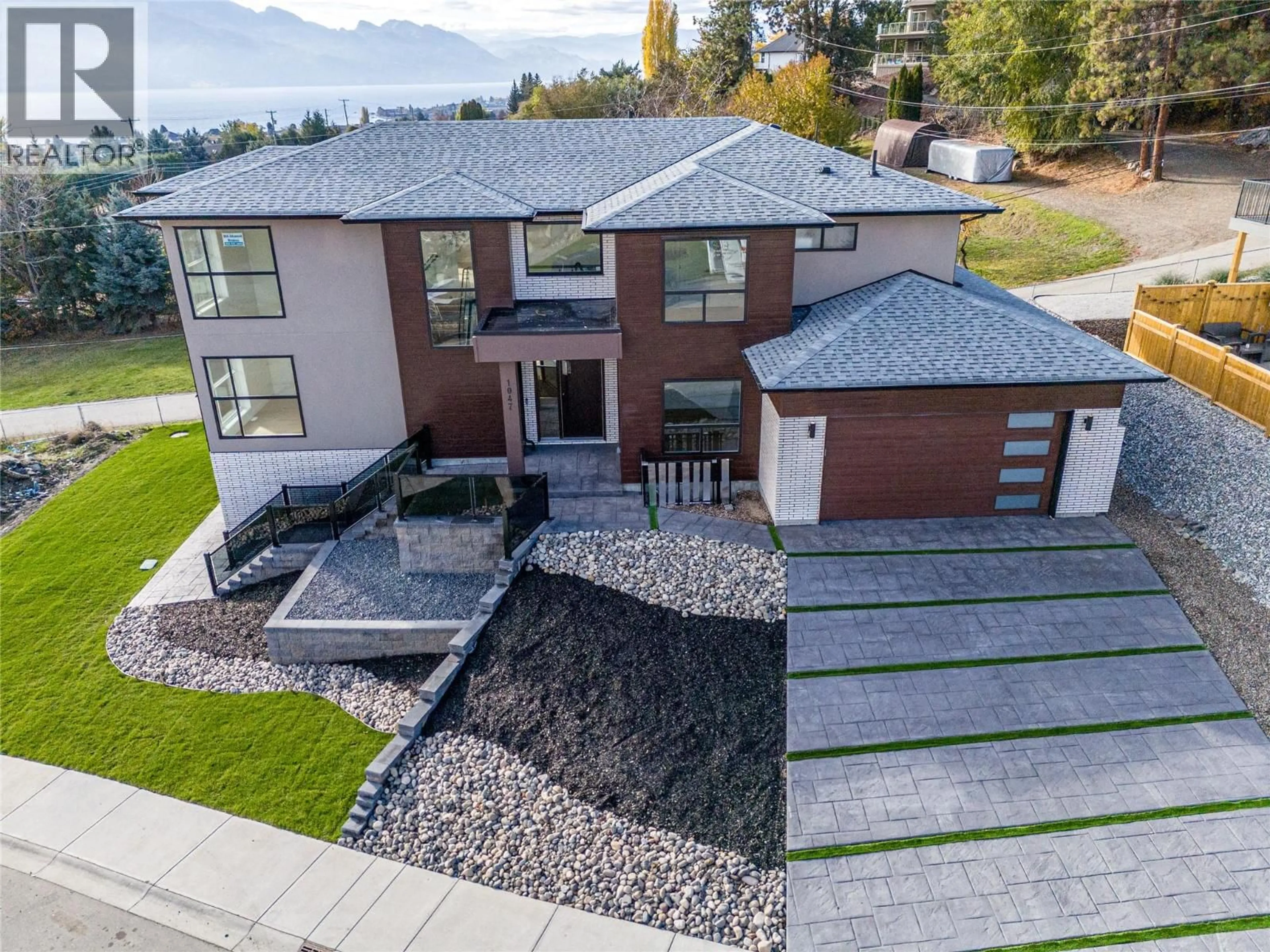 Home with brick exterior material, street for 1047 OAK BARREL PLACE, West Kelowna British Columbia V1Z2G9