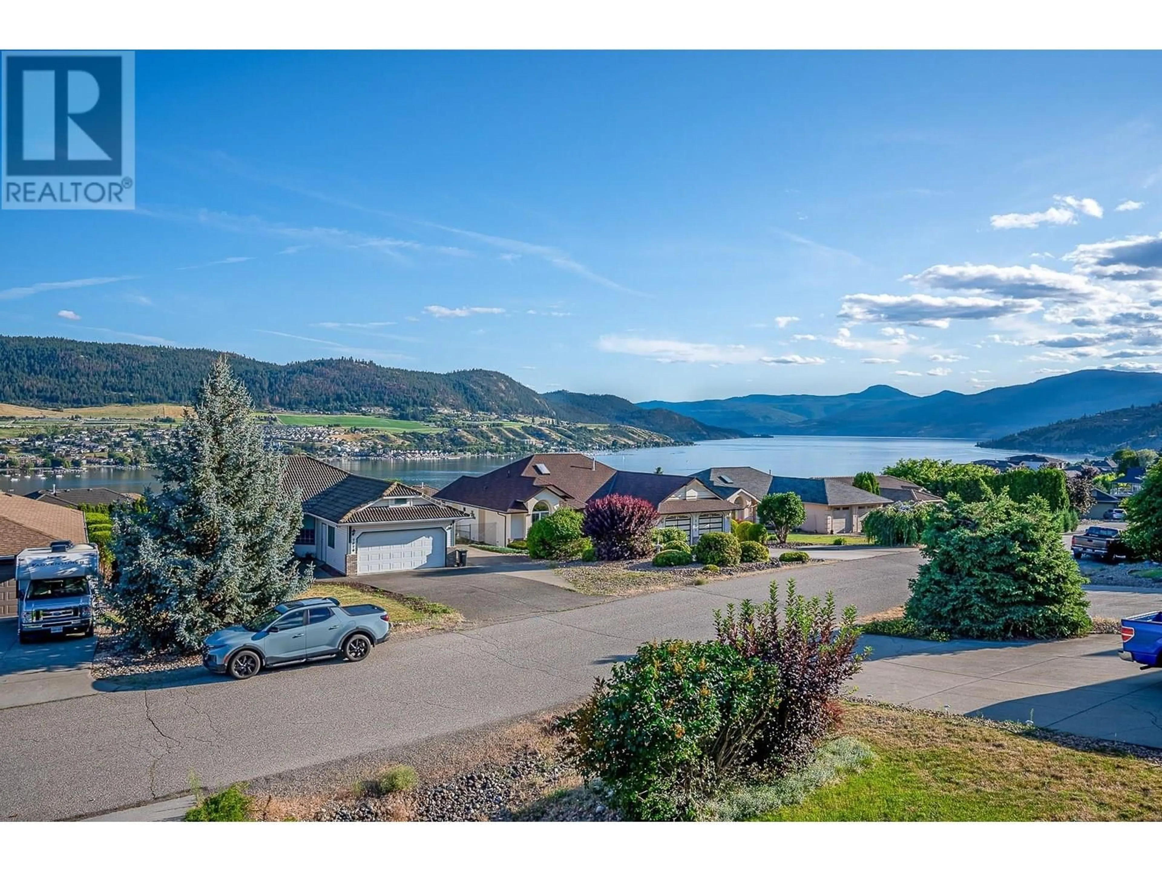 A pic from outside/outdoor area/front of a property/back of a property/a pic from drone, water/lake/river/ocean view for 7067 AMBER DRIVE, Vernon British Columbia V1H1P4