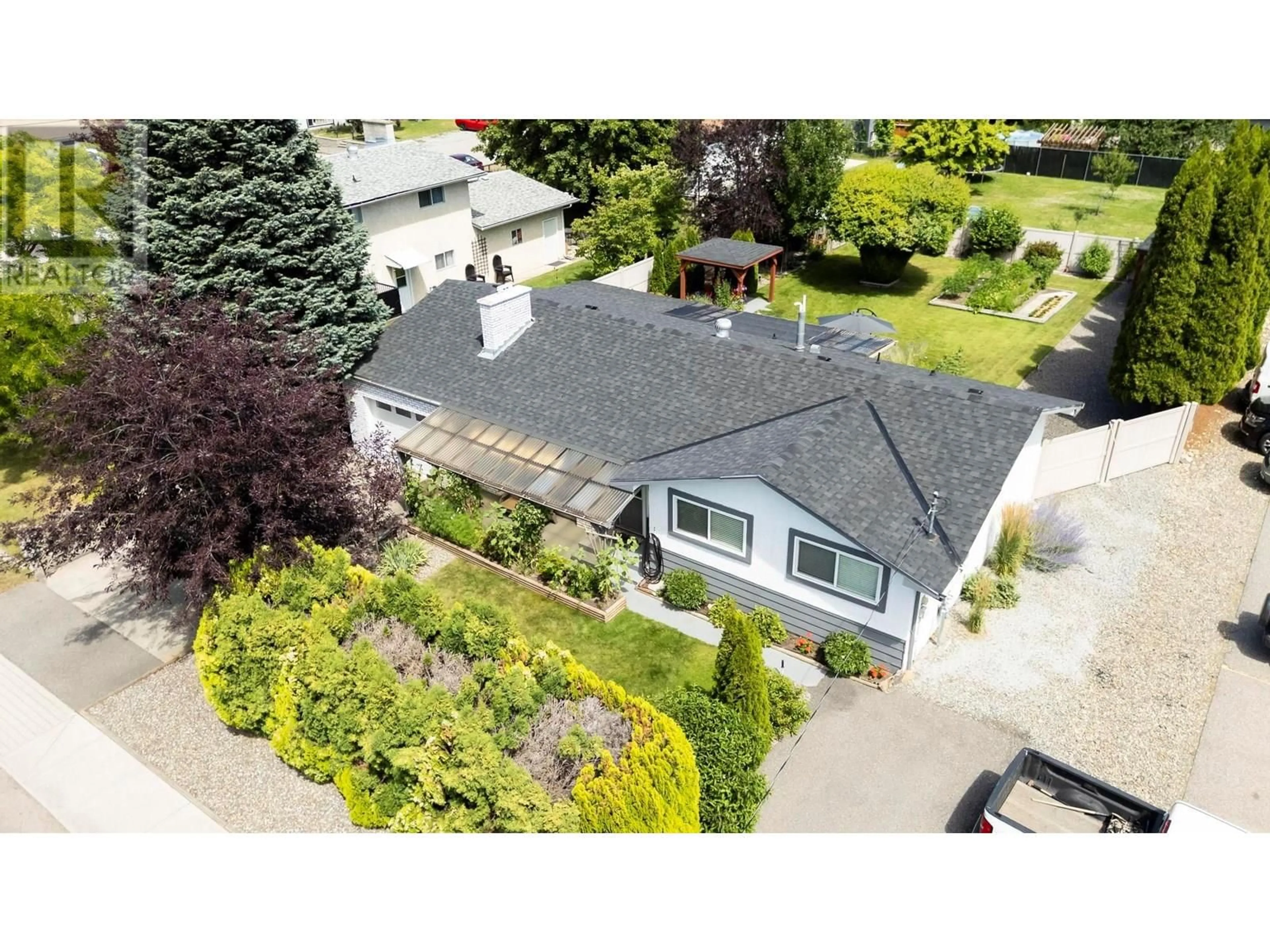 A pic from outside/outdoor area/front of a property/back of a property/a pic from drone, street for 615 TARTAN ROAD, Kelowna British Columbia V1X3L2