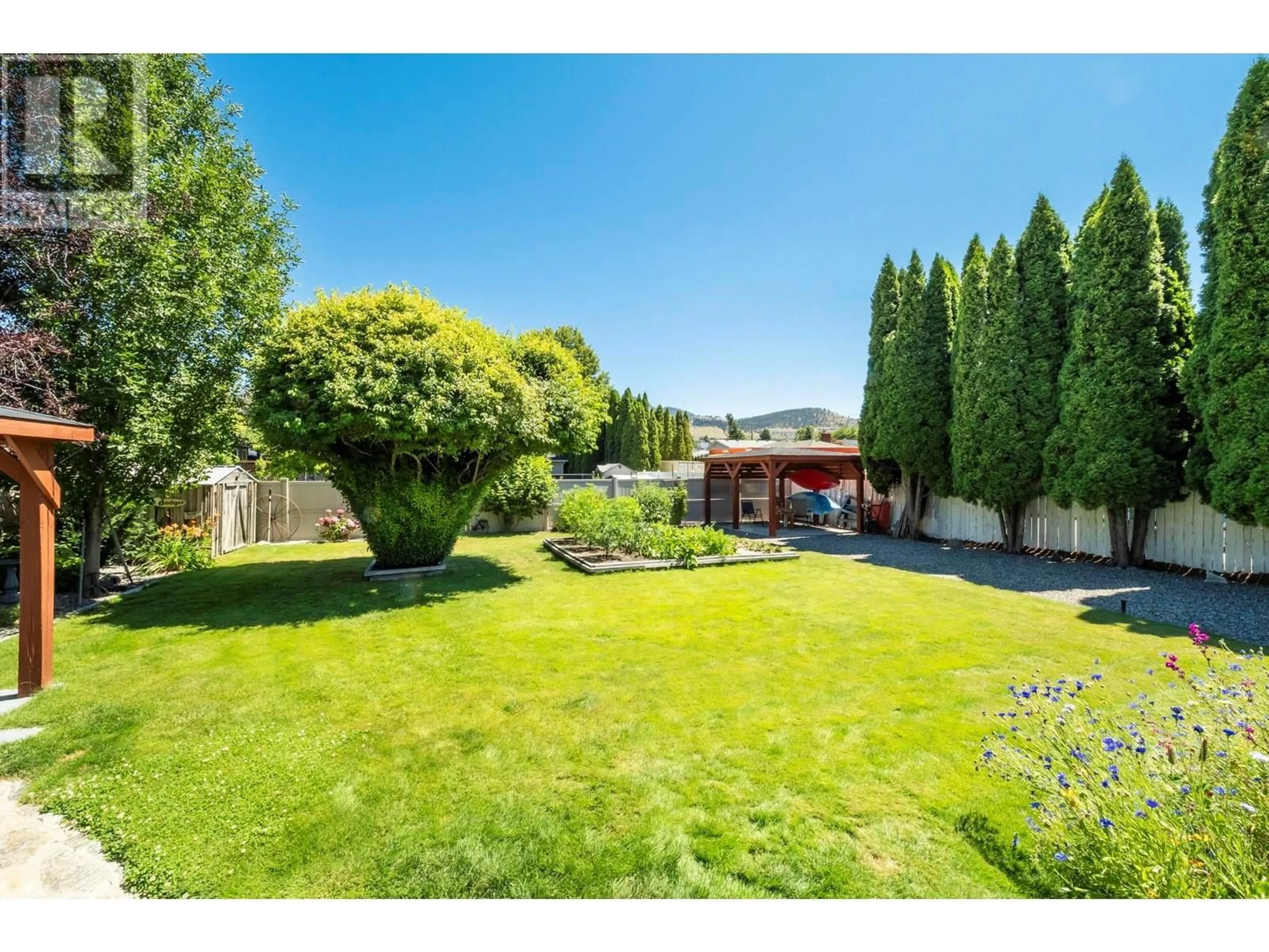 A pic from outside/outdoor area/front of a property/back of a property/a pic from drone, unknown for 615 TARTAN ROAD, Kelowna British Columbia V1X3L2