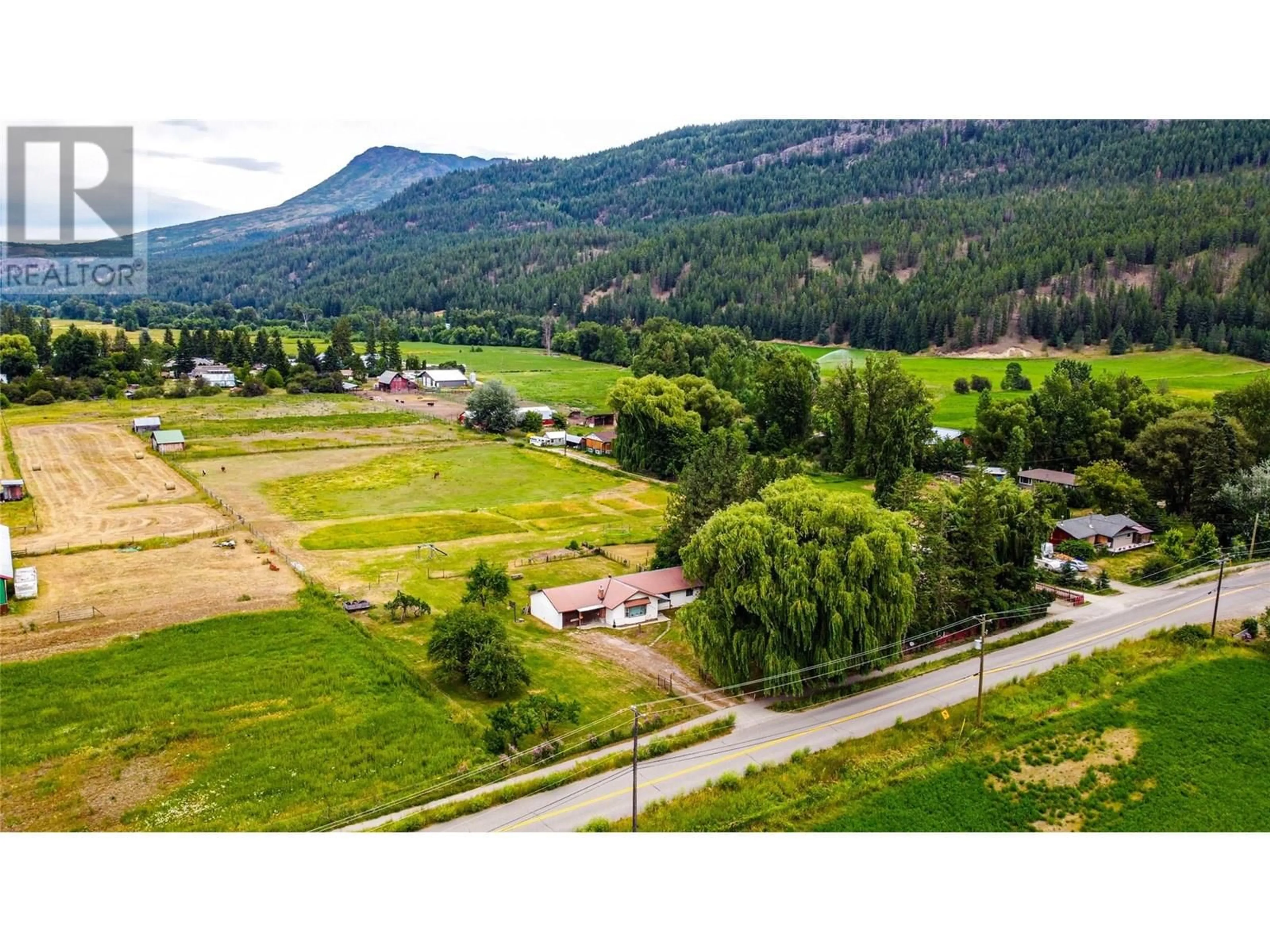 A pic from outside/outdoor area/front of a property/back of a property/a pic from drone, mountain view for 1365 SALMON RIVER ROAD, Salmon Arm British Columbia V1E3H3