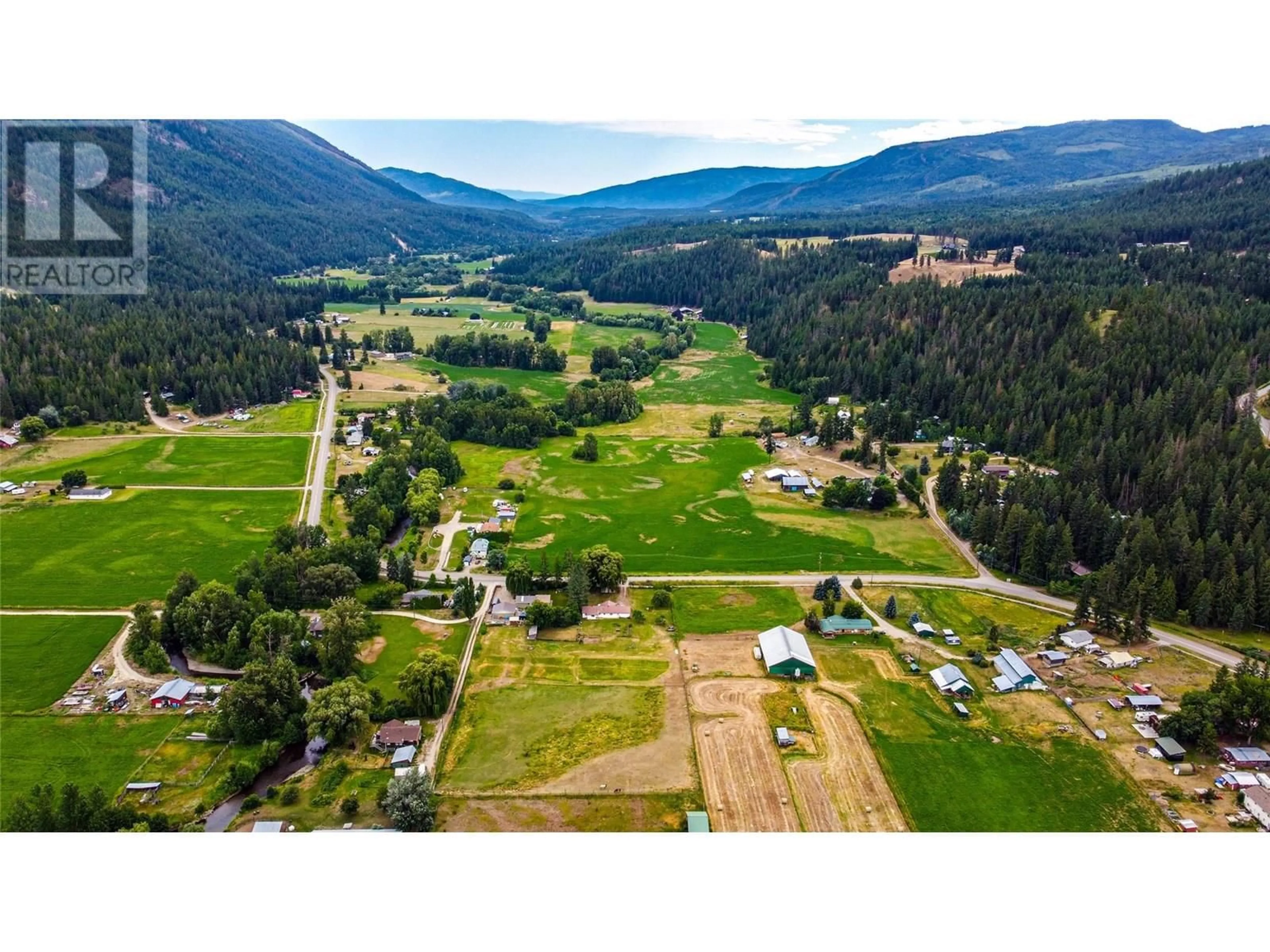 A pic from outside/outdoor area/front of a property/back of a property/a pic from drone, mountain view for 1365 SALMON RIVER ROAD, Salmon Arm British Columbia V1E3H3