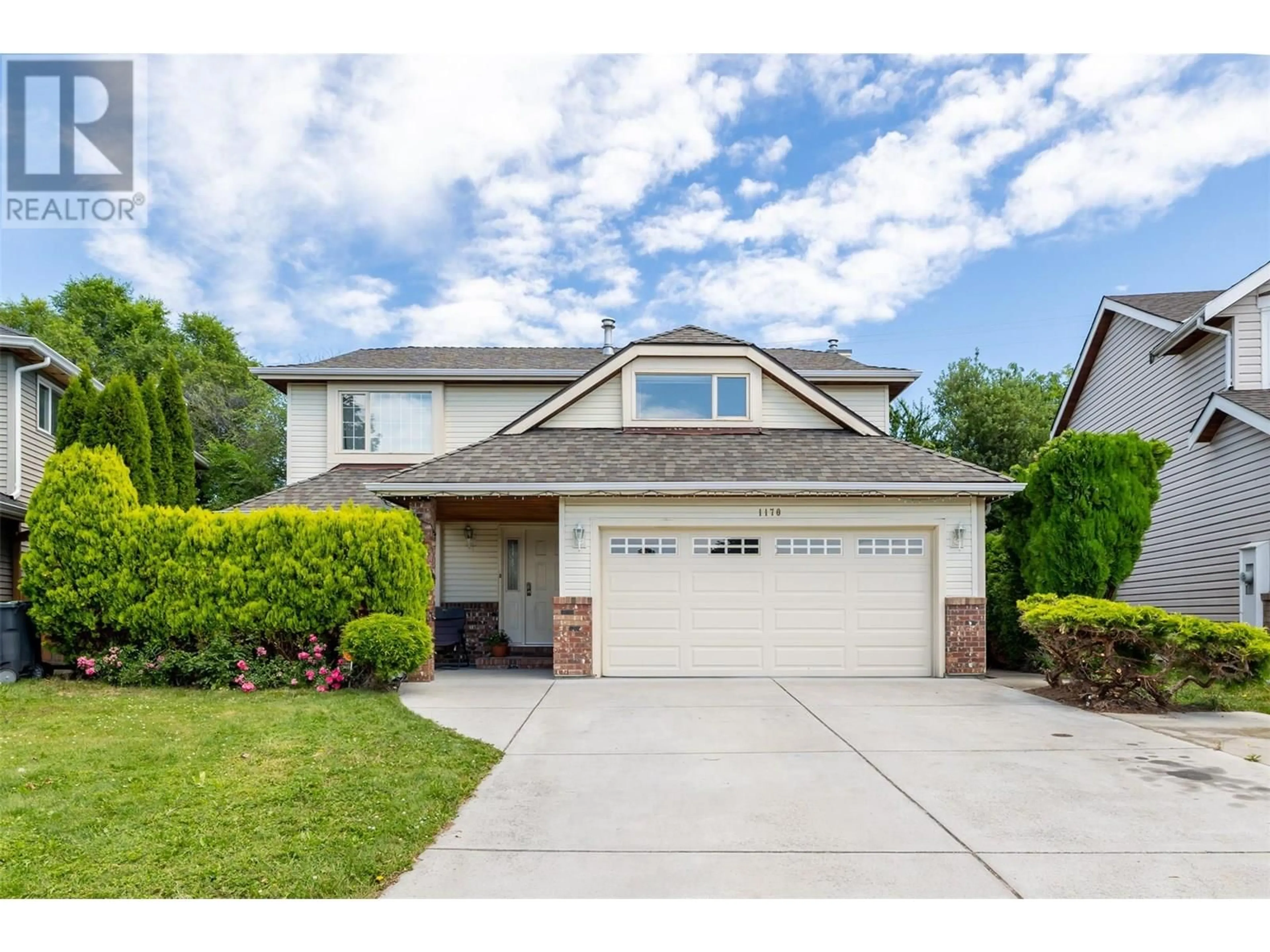 Home with vinyl exterior material, street for 1170 WINTERGREEN CRESCENT, Kelowna British Columbia V1W3V8