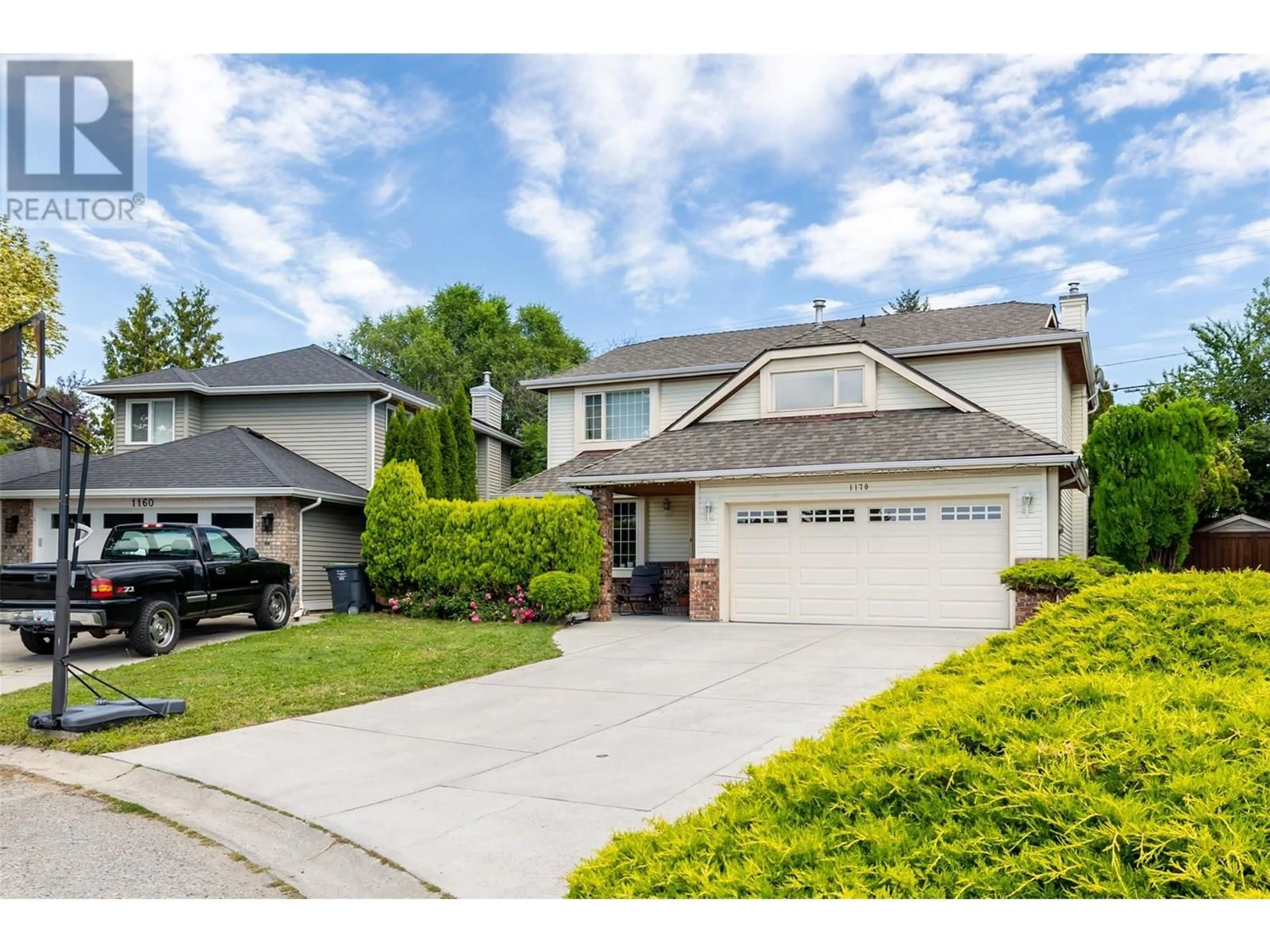 Home with vinyl exterior material, street for 1170 WINTERGREEN CRESCENT, Kelowna British Columbia V1W3V8