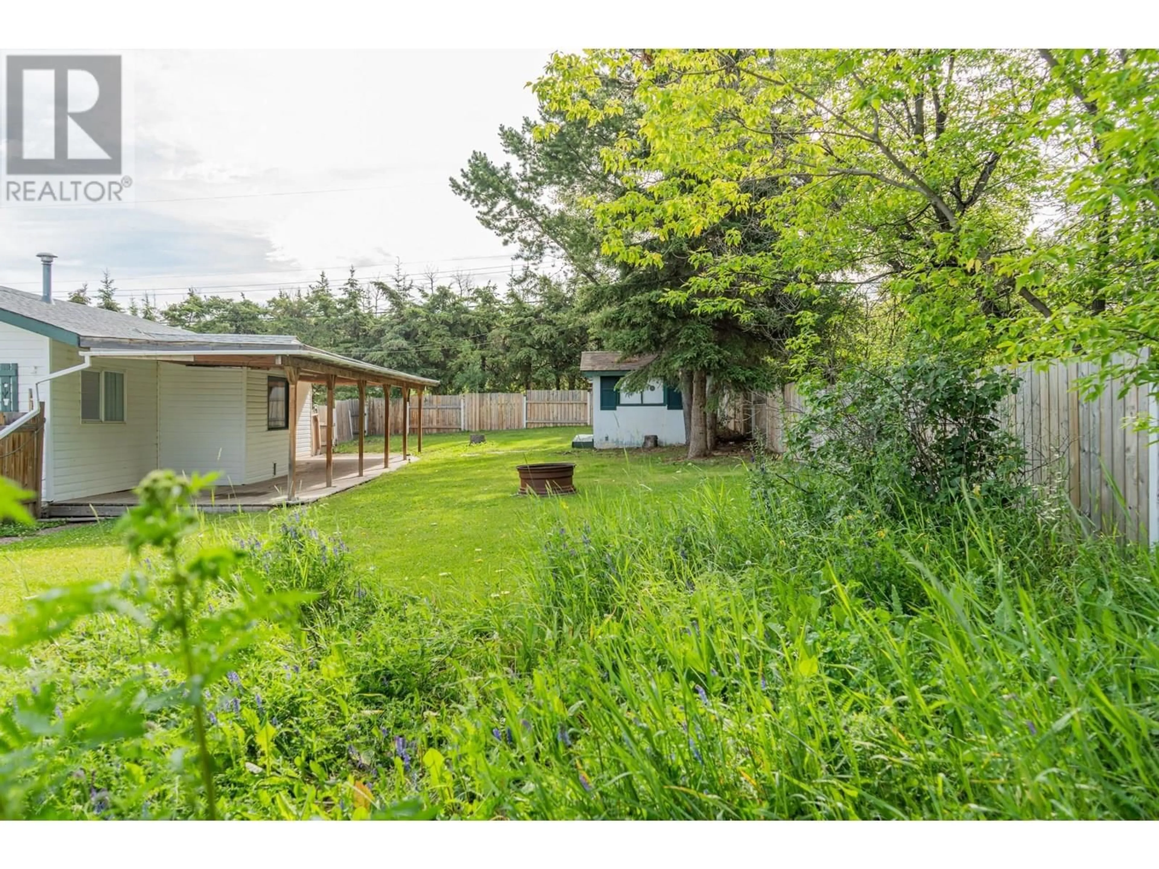 A pic from outside/outdoor area/front of a property/back of a property/a pic from drone, forest/trees view for 1715 HARPER OTHER, Dawson Creek British Columbia V1G4E8